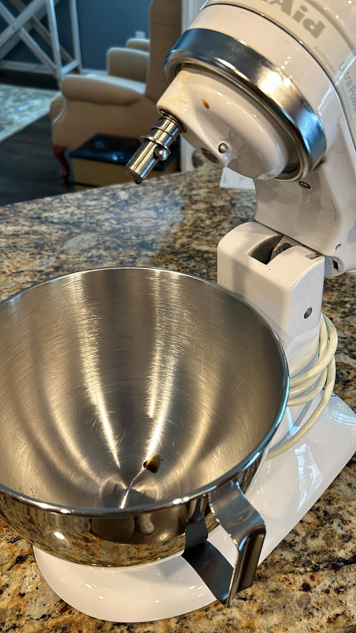 Why does my KitchenAid mixer leak oil?