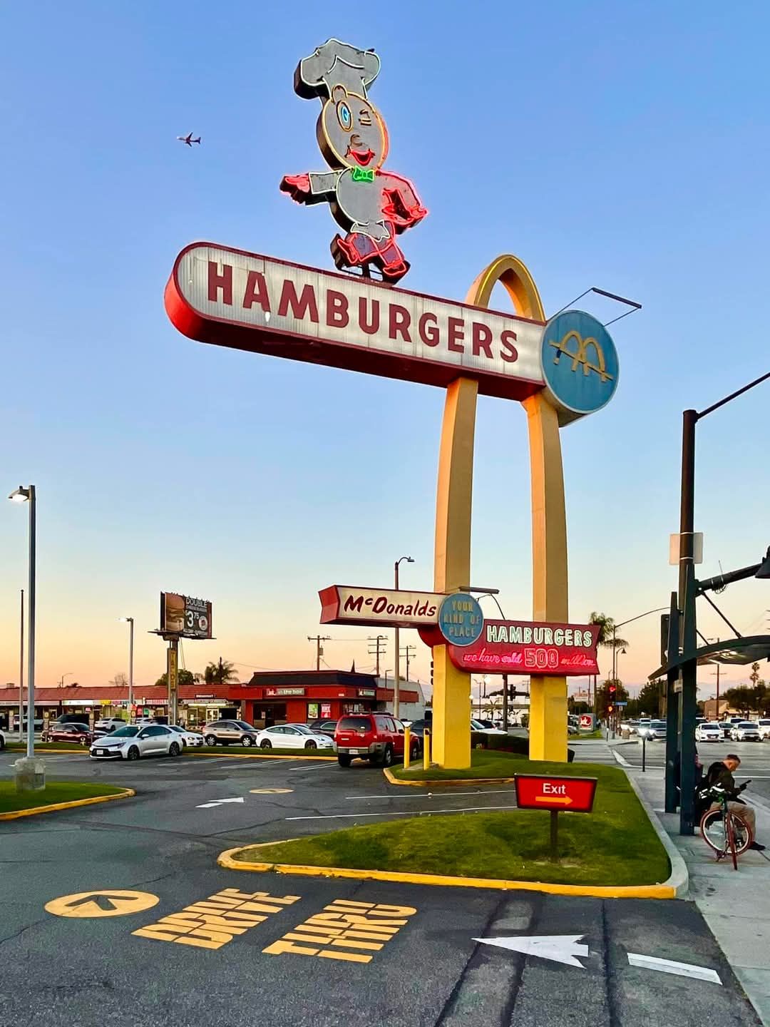 Original McDonald's sign with a single golden arch and speedee logo