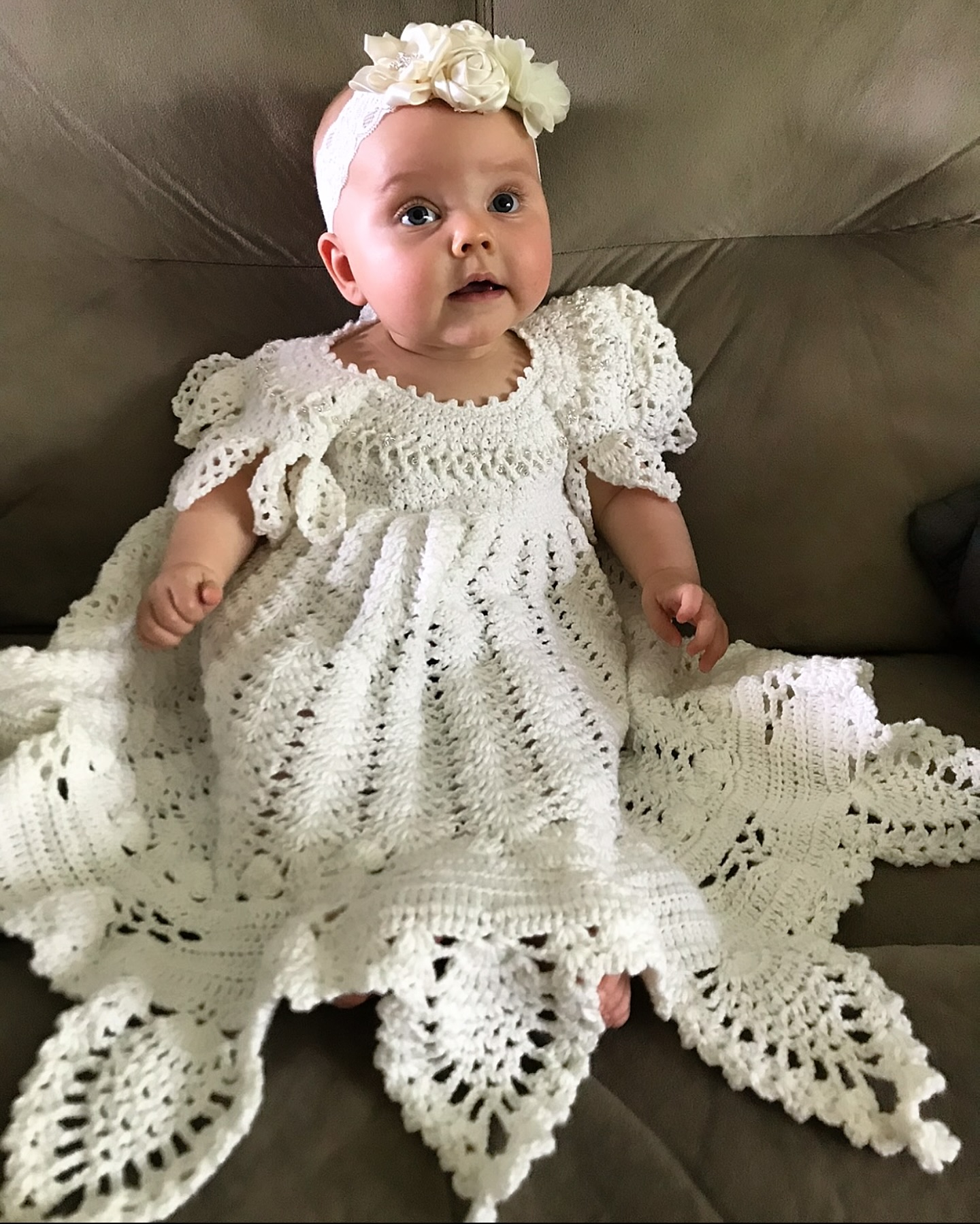 My youngest daughter Mary decided to try on her big sister's First Communion dress. It's a little big, but she has a few years to grow into it