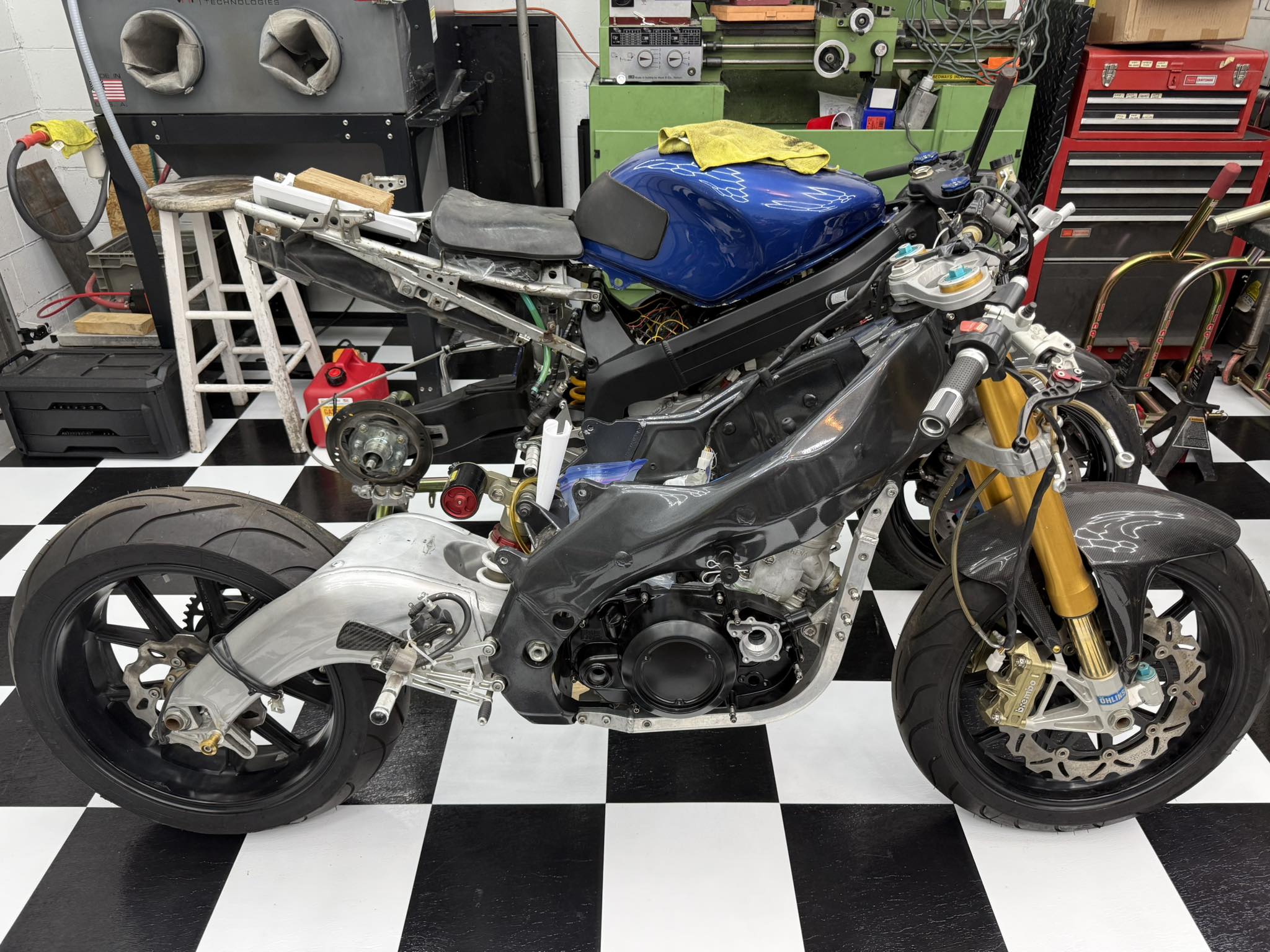 Aprilla RS 250 motorcycle with RZ350/421 kit in workshop