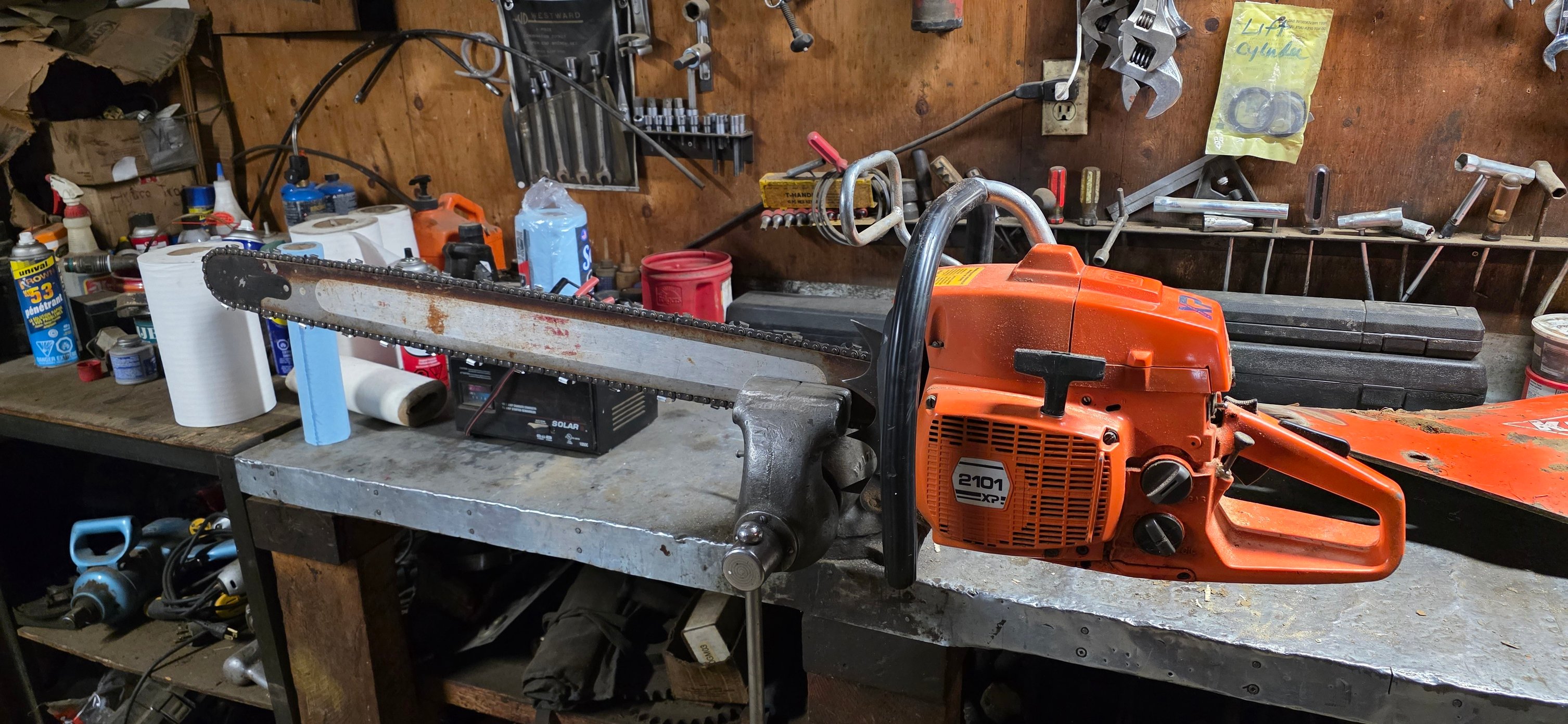 Husqvarna 2101 XP chainsaw in a workshop