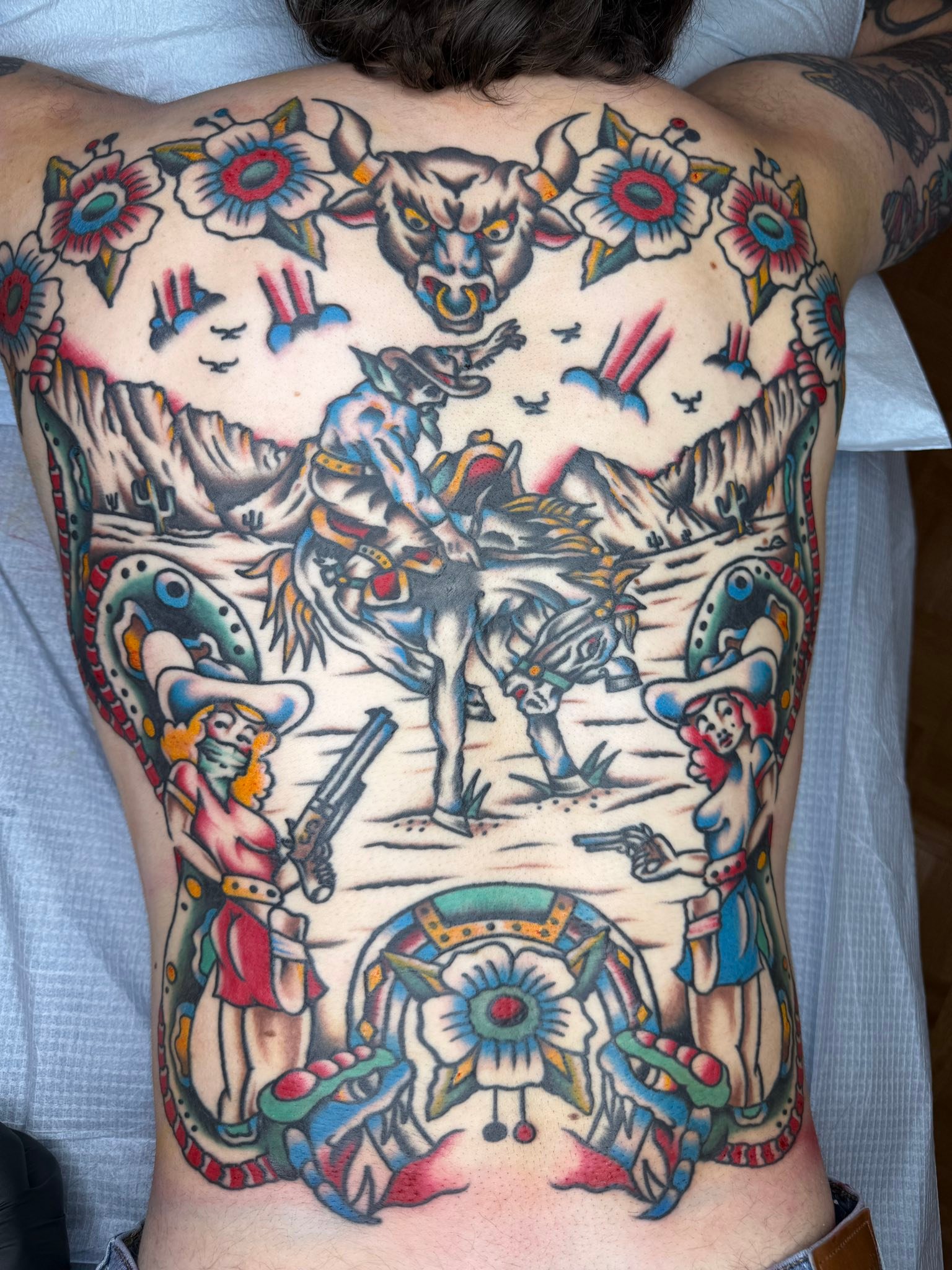 New western backpiece tattoo in Montreal, QC