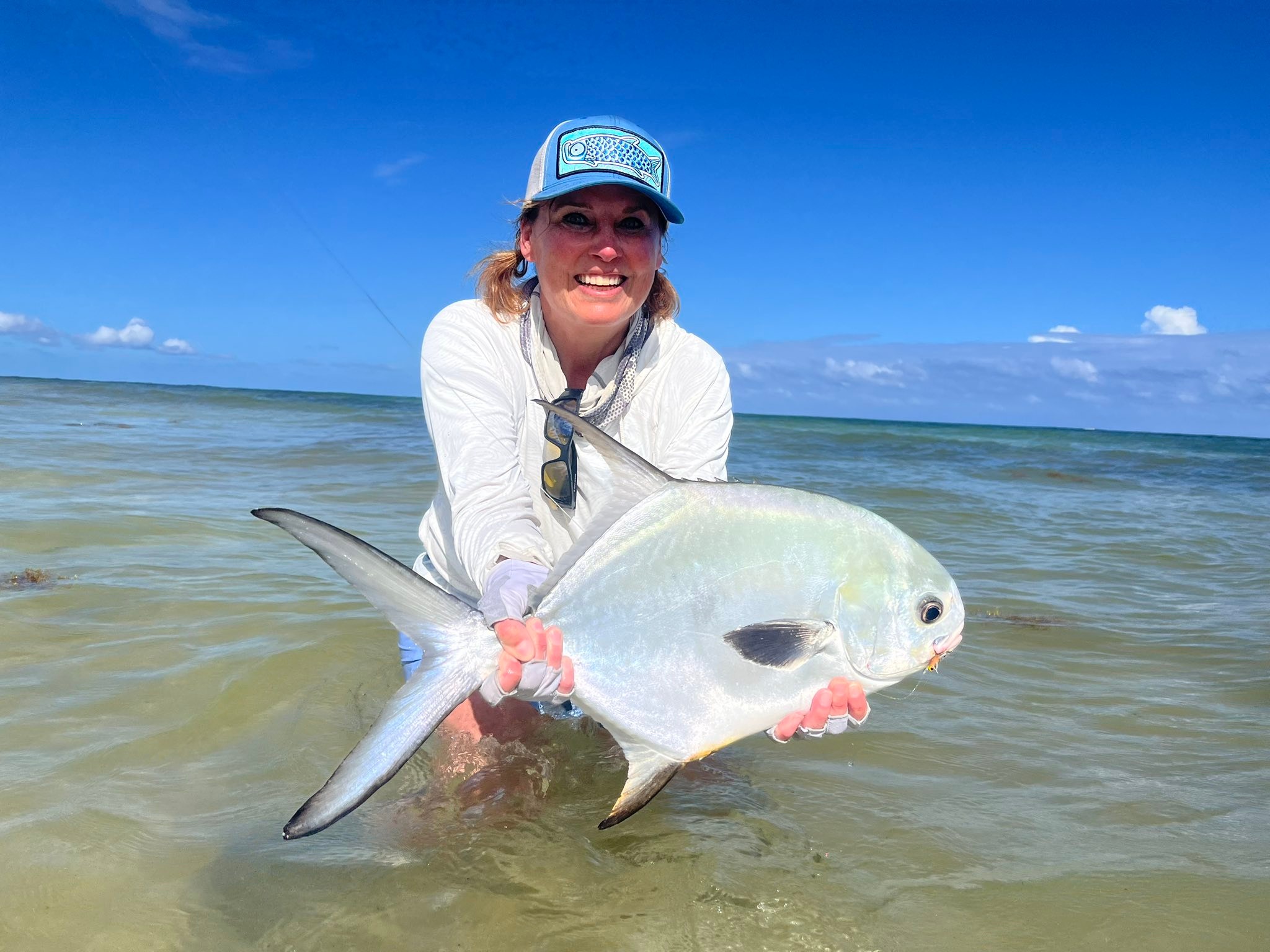Allison catches her first permit fish in the Yucatan
