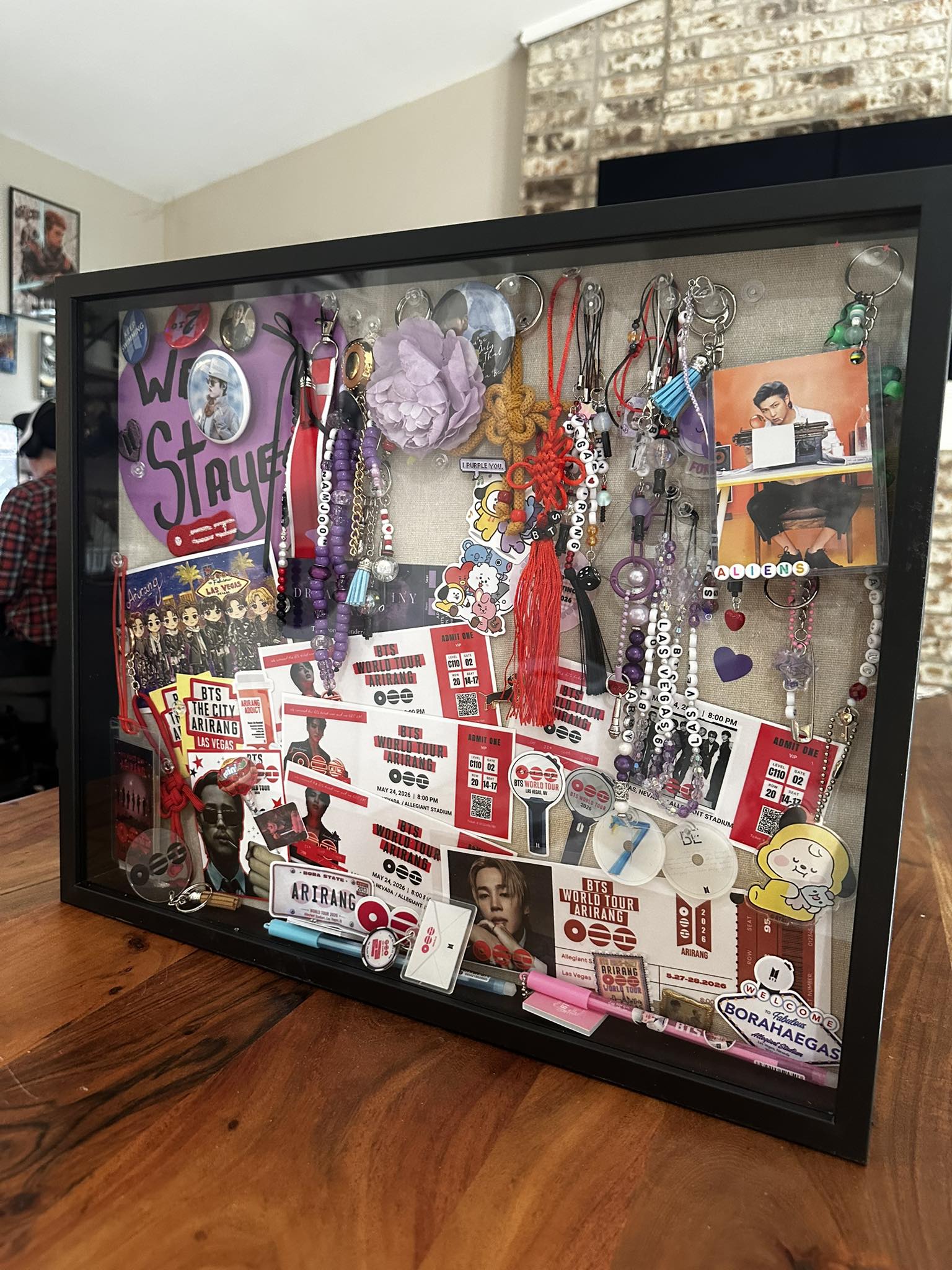 BTS fan's shadow box with freebies from Las Vegas tour