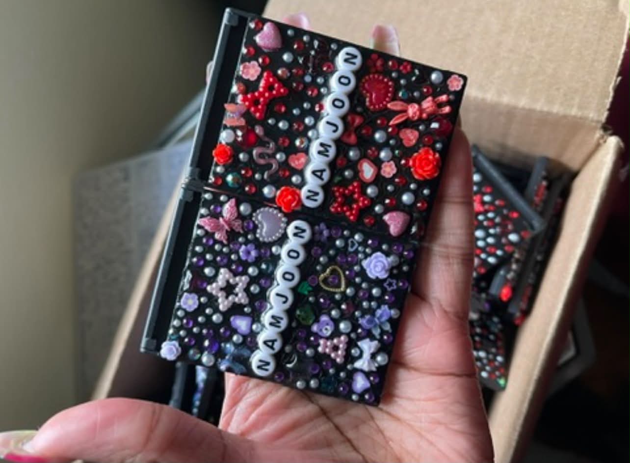 Free BTS concert freebies including compact mirrors, bracelet, and