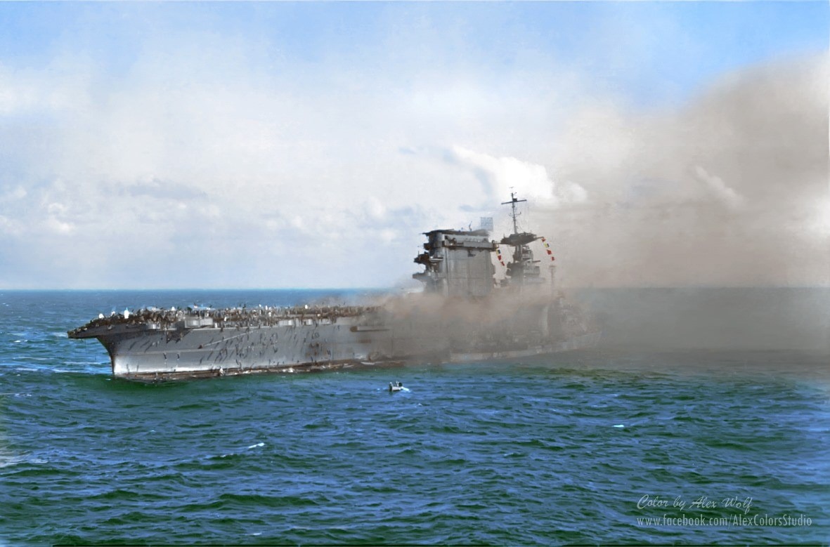 U.S. sailors abandon the aircraft carrier USS Lexington after she