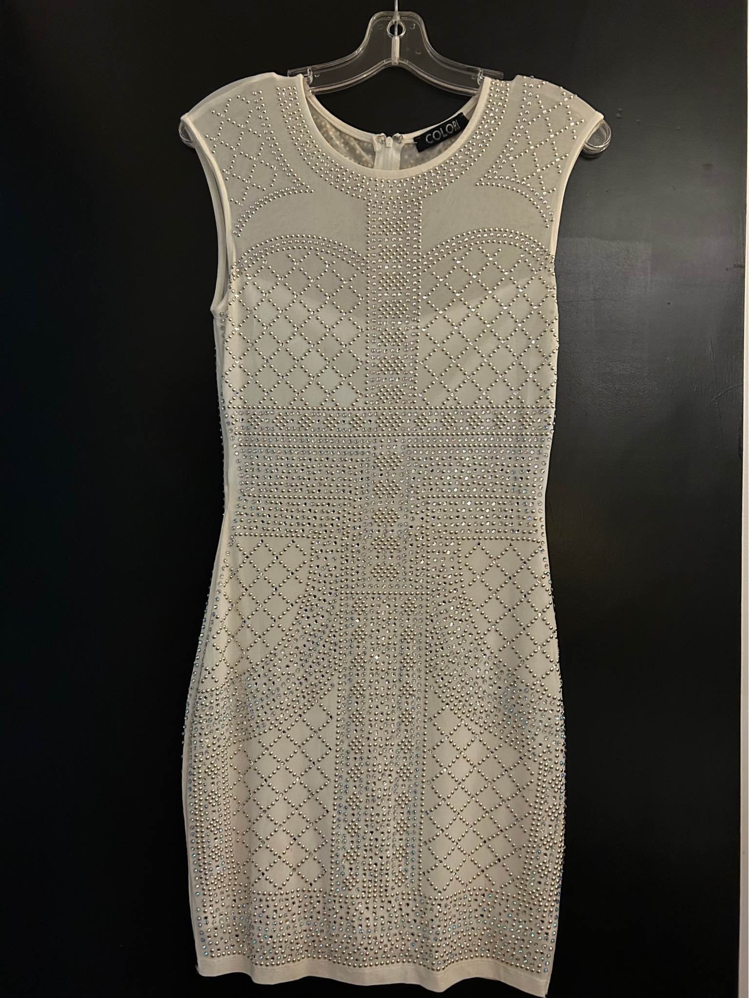 white and silver bodycon dress Size medium Check out my other listings Elegant sleeveless from Colori. This garment has a mesh overlay adorned with an intricate rhinestone pattern. It has a round neckline Mini dress quiz