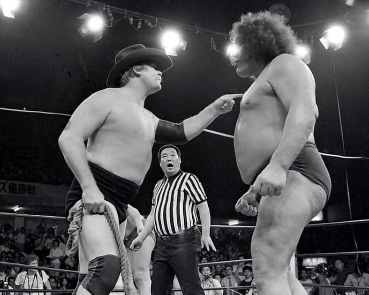 Stan Hansen with a big lariat on Andre the Giant.