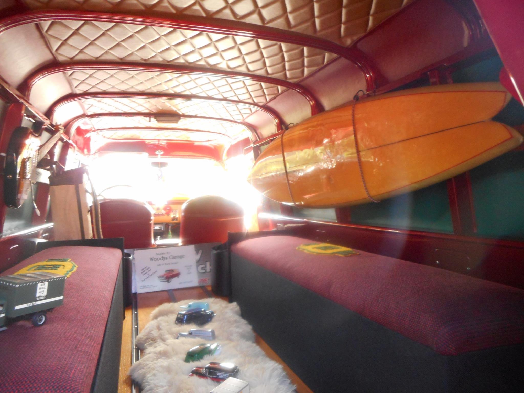 1940's neon lime green woody surf wagon with surfboards on top