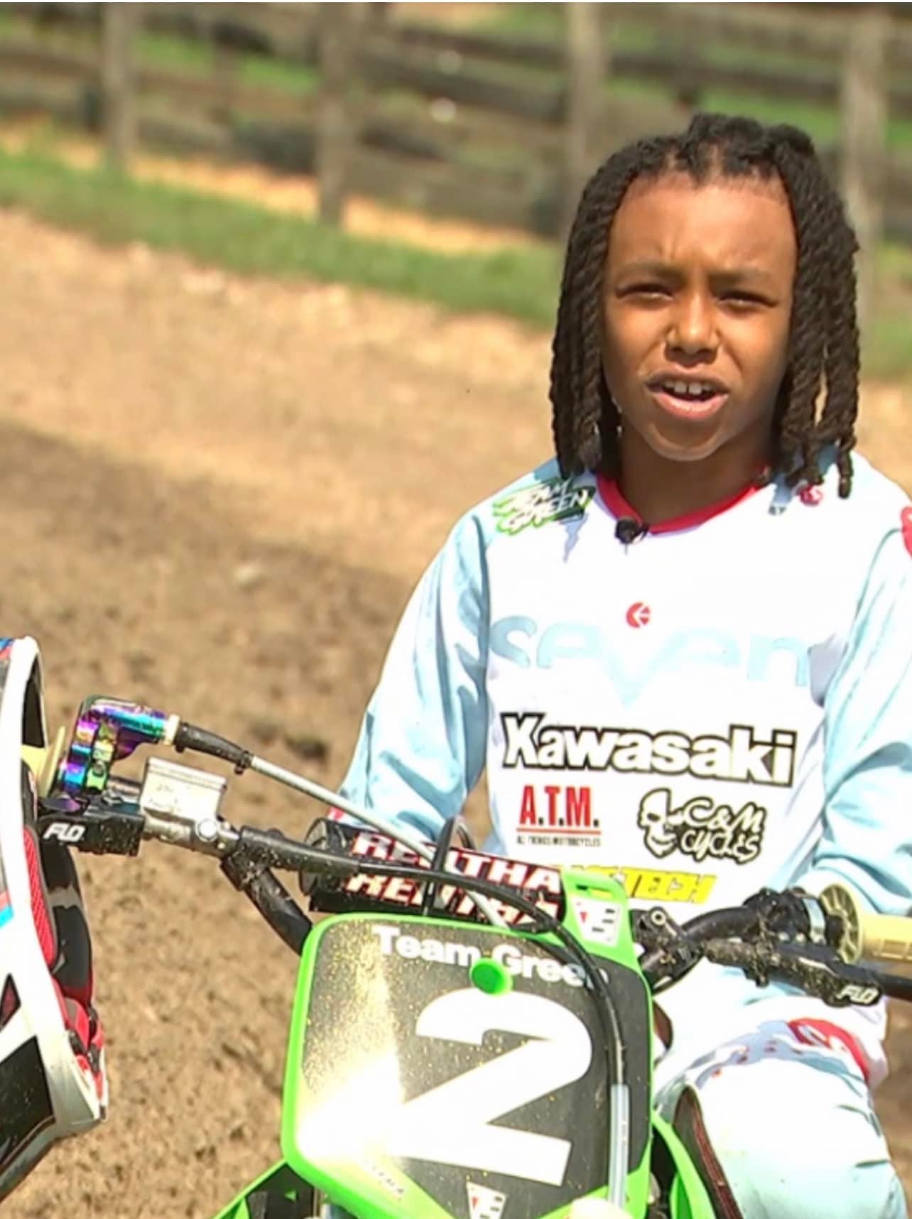Proud owner of new red dirt bike takes first ride