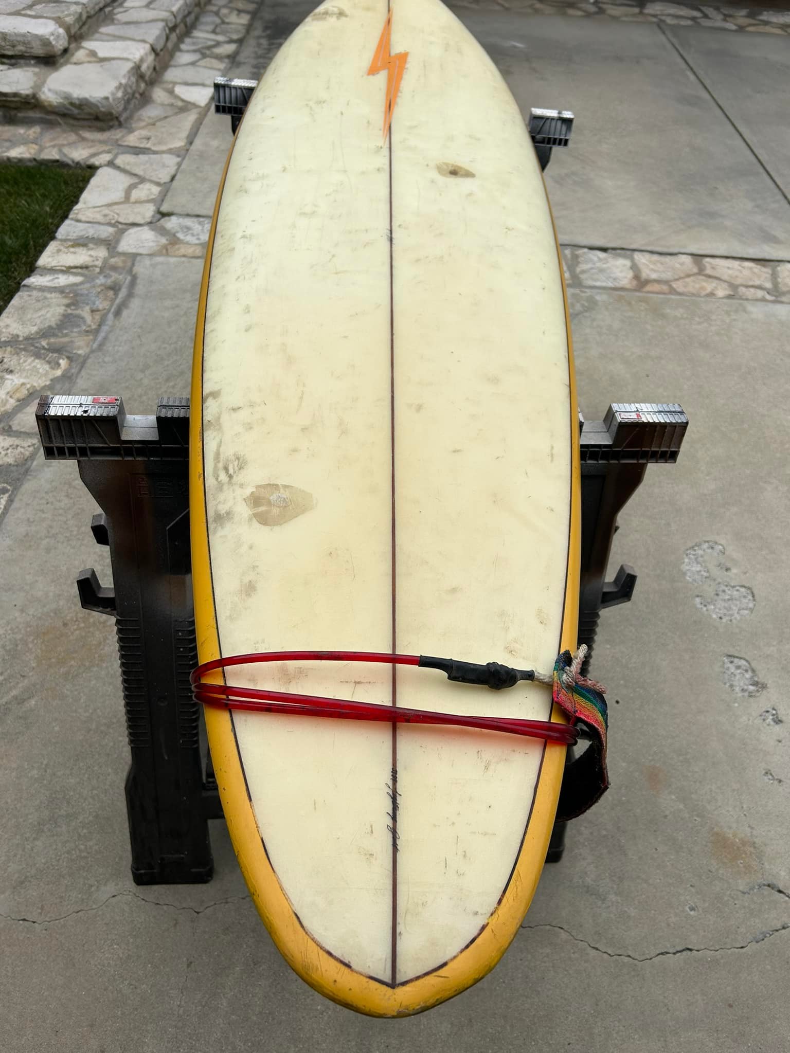 What is the history and value of a 7ft Lightning Bolt surfboard?