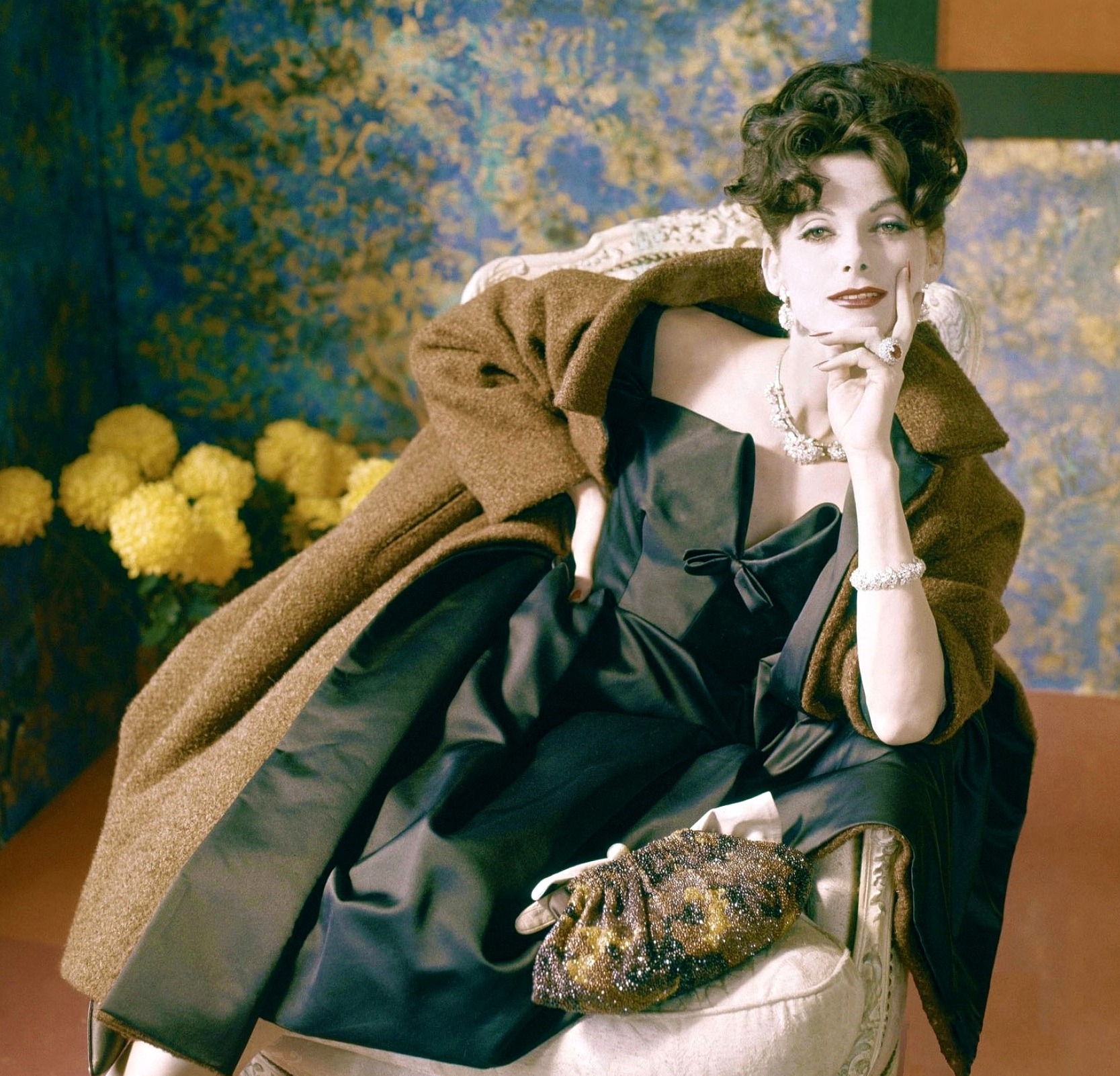Model in orange bouclé two-piece by Pierre Cardin, photo by Joseph