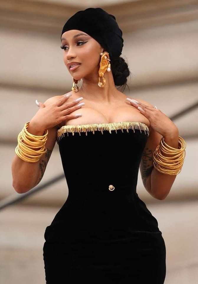cardi b gold chain dress stuns whilst out in Paris in this Destin water inspired garment Gold Cape