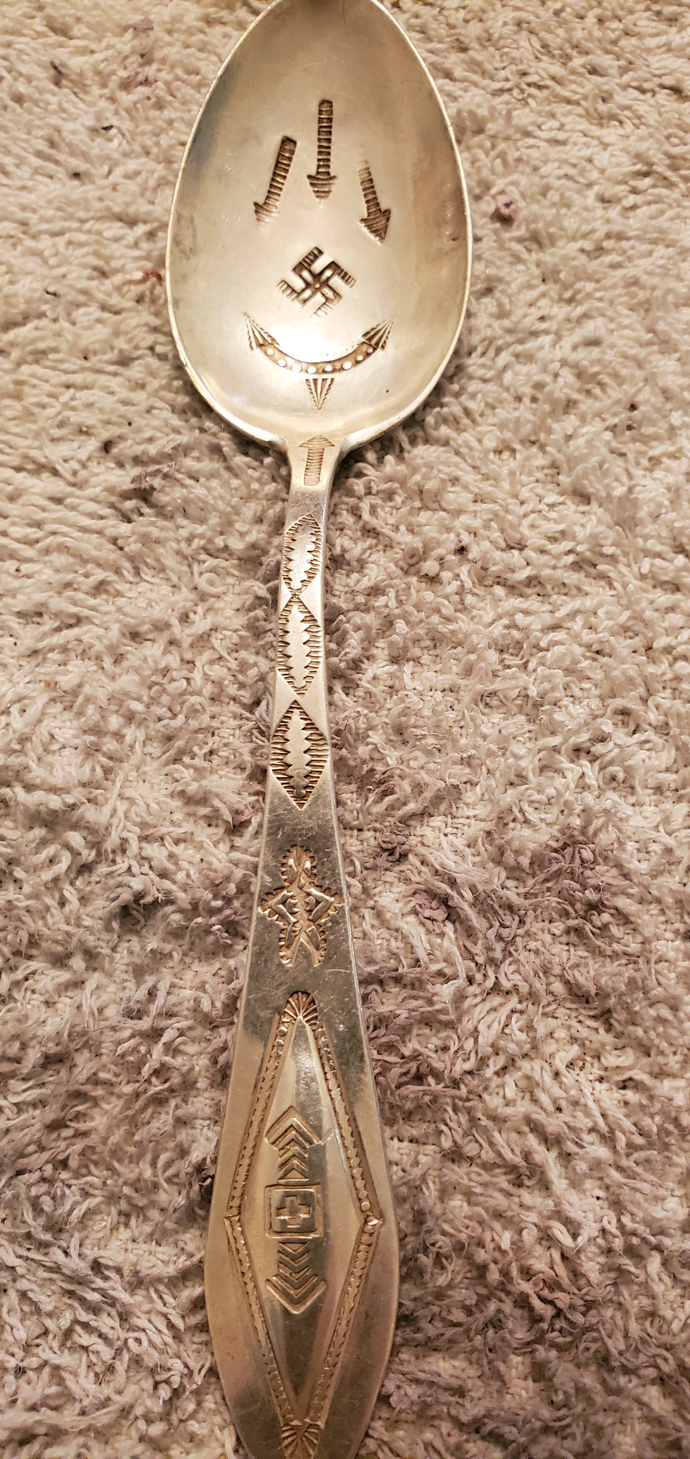 Discovering Navajo whirling log symbol on vintage silverware