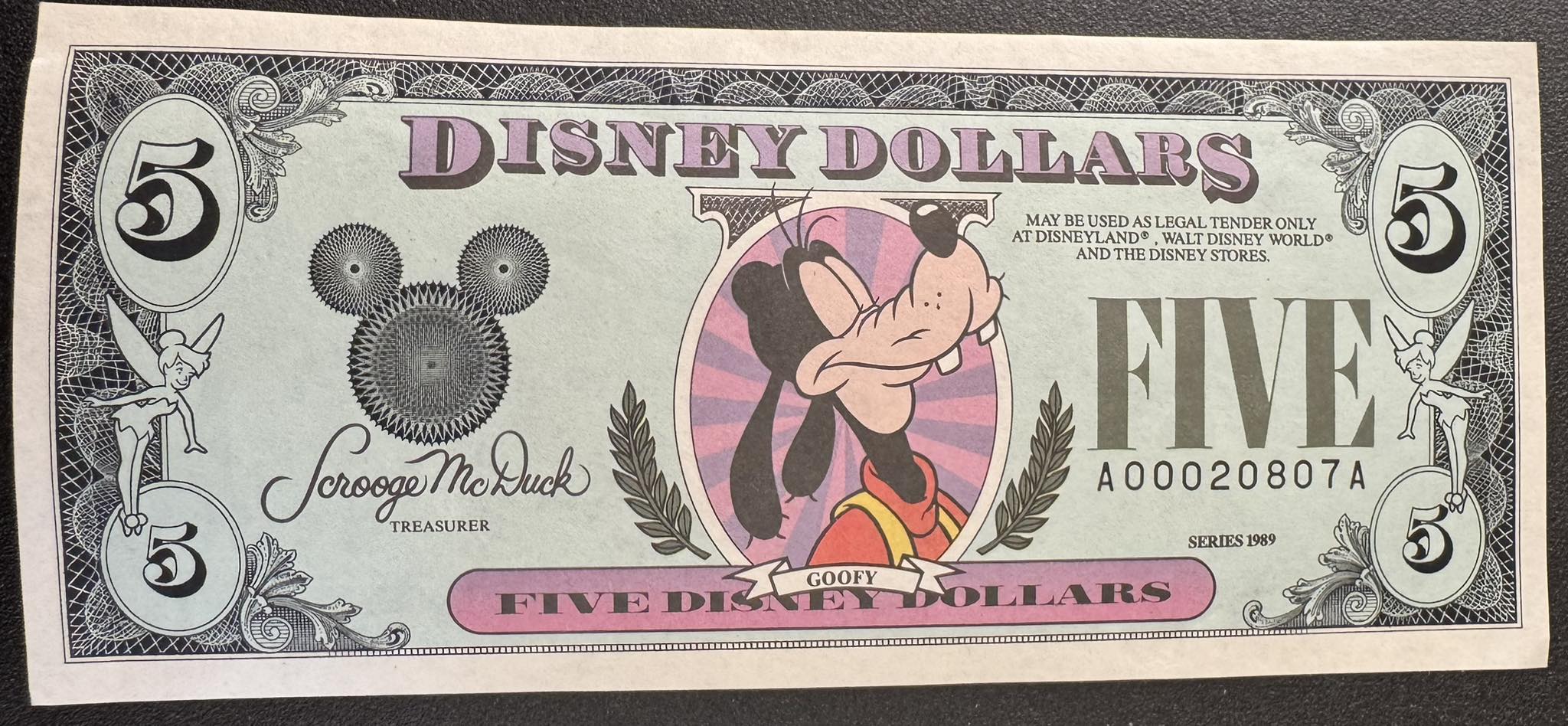 1987 – “Disney Dollars” roll off Mickey's printing press for the
