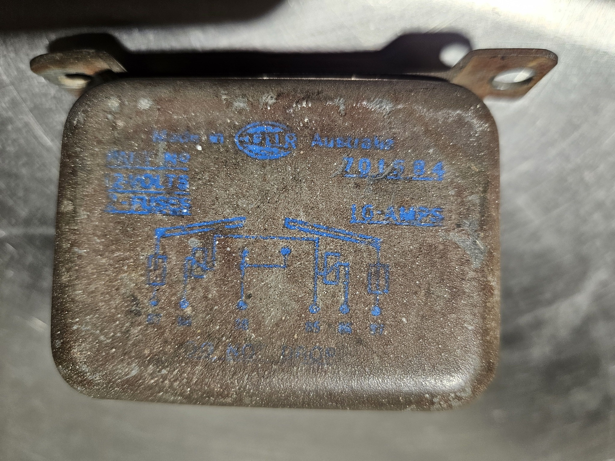 What is the text on a Valiant Charger driving light relay?