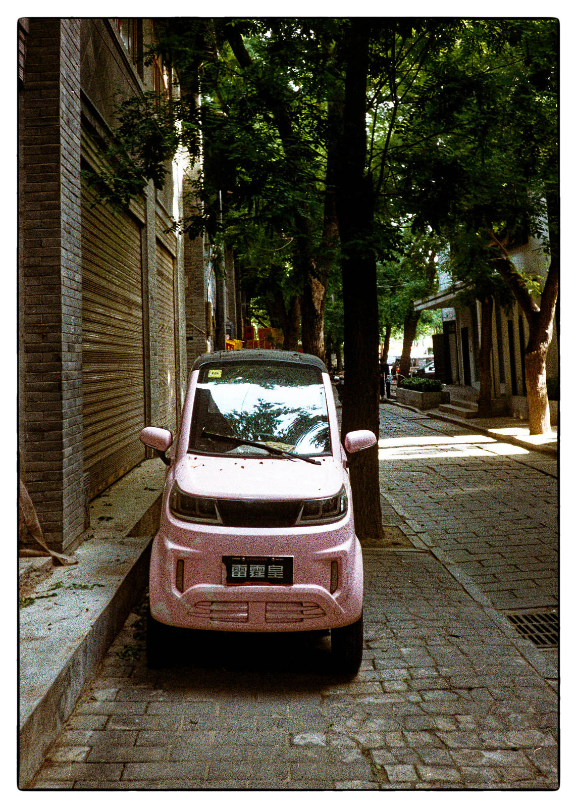 Mini-car in the streets of Xi'an. Pentax 17 + Kodak Gold 200.