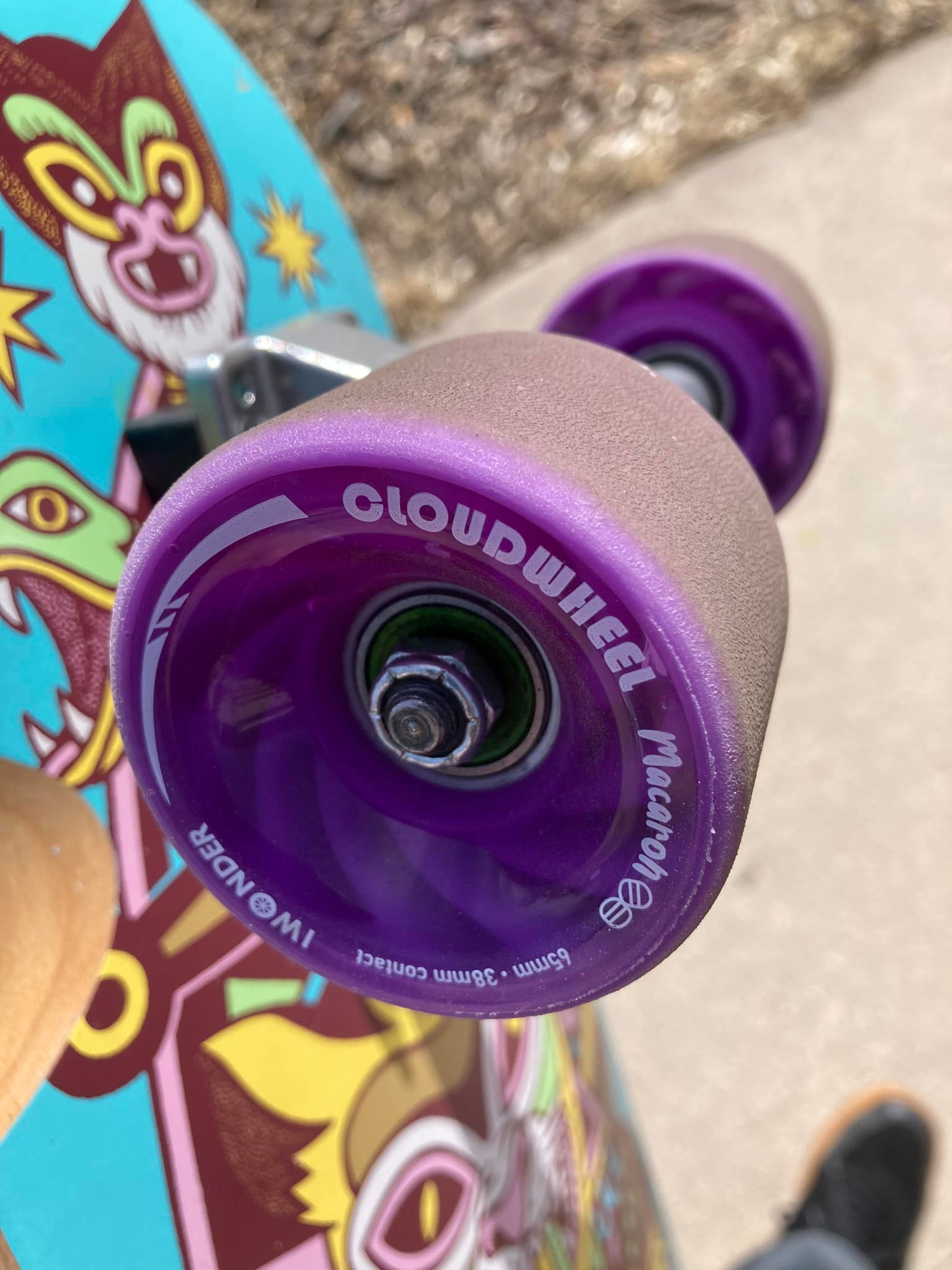 Riding Cloud Ride Iceez wheels on a short surfskate board