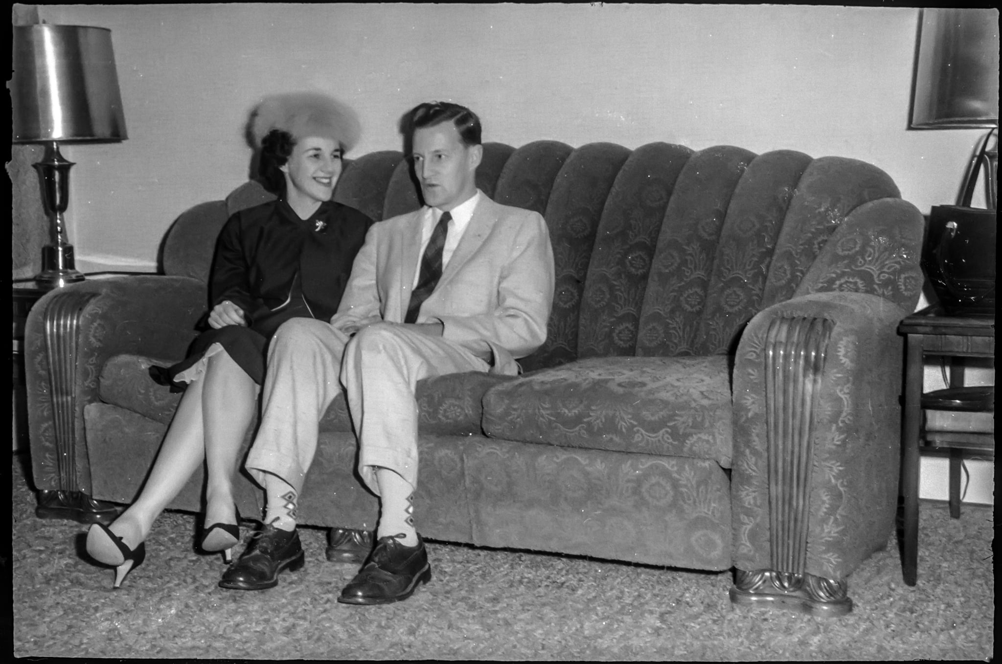 The vintage archives. Unidentified couple on a couch circa late 1950's