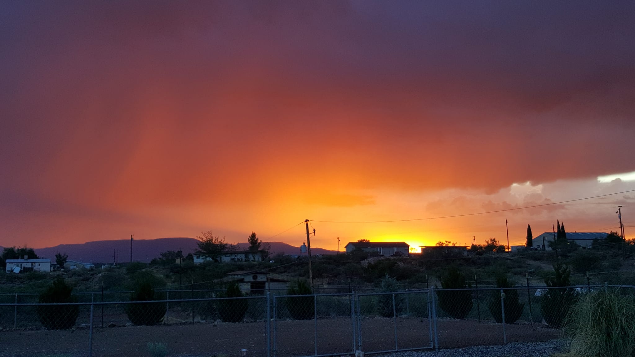 Just a little rain as the sun goes down. Avra Valley, Arizona USA