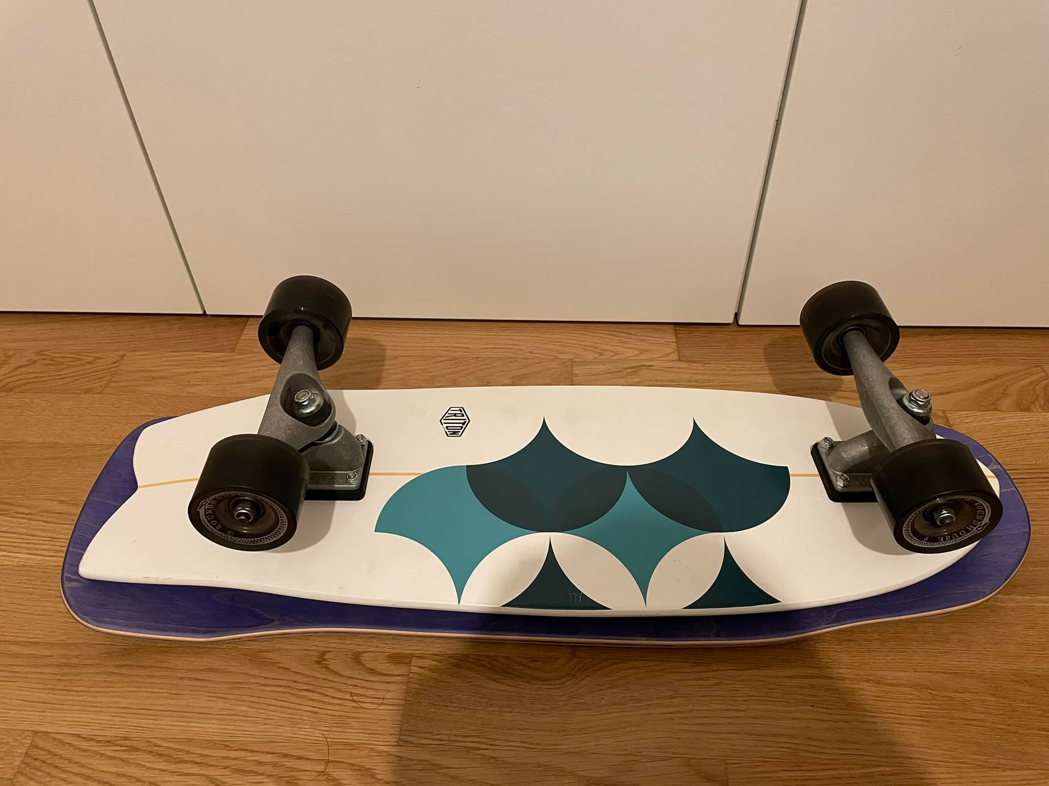 Riding a Santa Cruz Winkowski Volcano deck on a surfskate