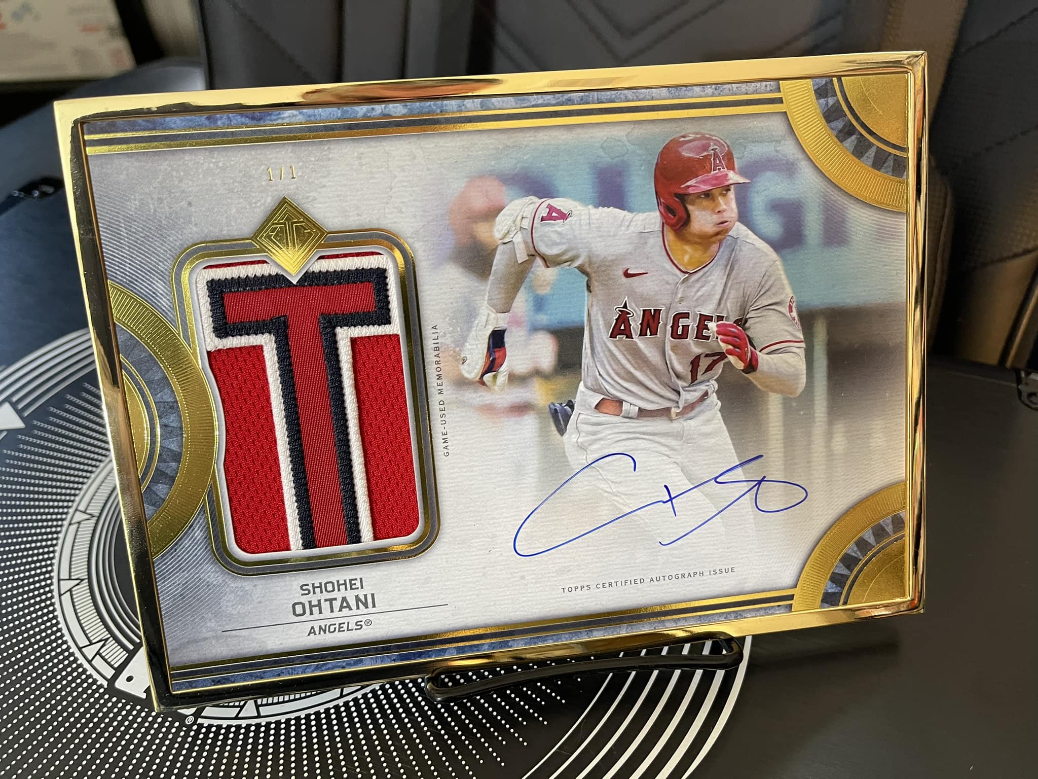 This Shohei Ohtani 1/1 autograph card has a GIANT piece of a ball 