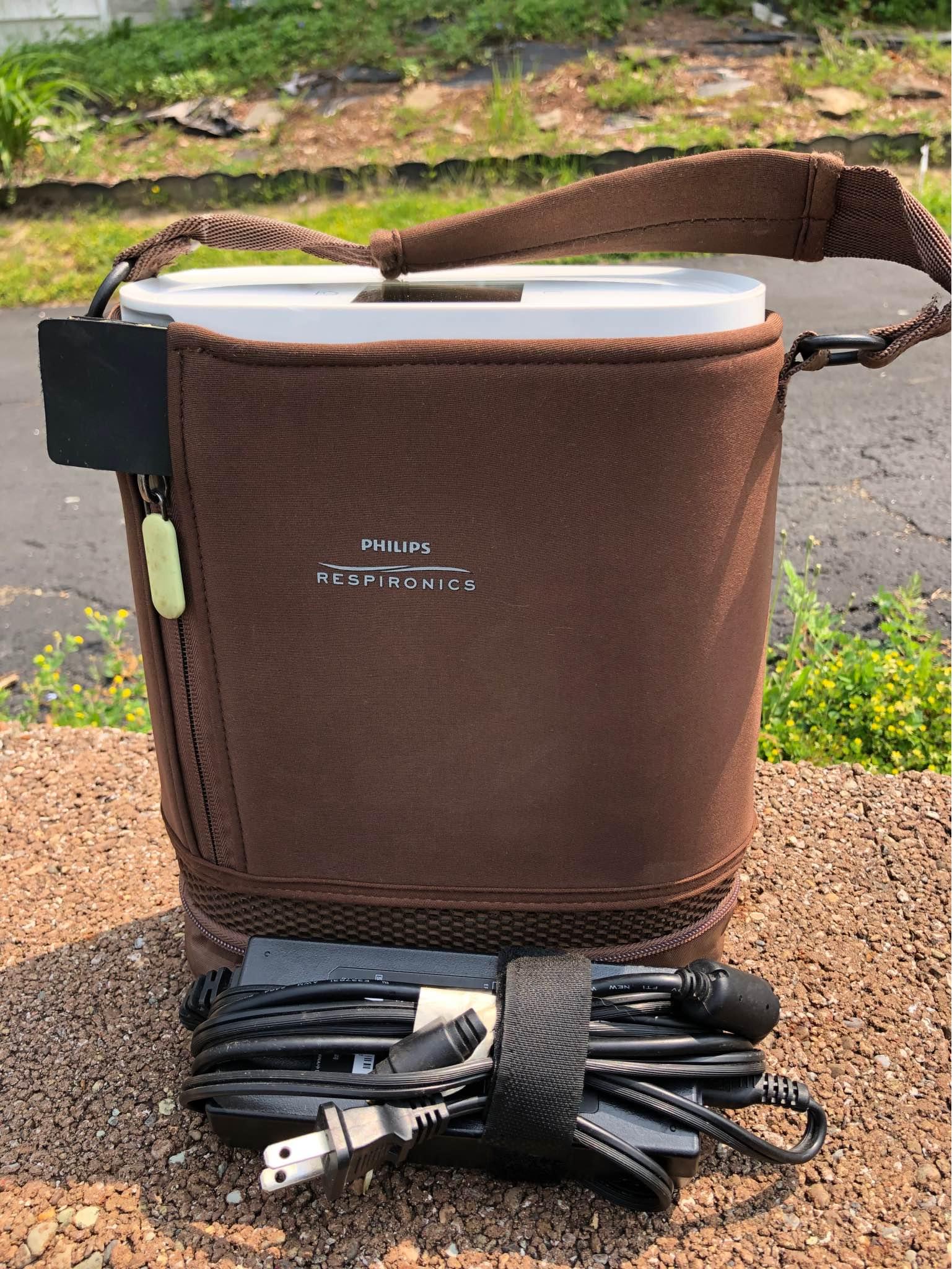https www.oxygenconcentratorstore.com respironics-simplygo-mini-backpack-brown SimplyGo Mini Backpack A carrying handle is sewn into the top of the backpack and sturdy Respironics SimplyGo Mini Portable Oxygen