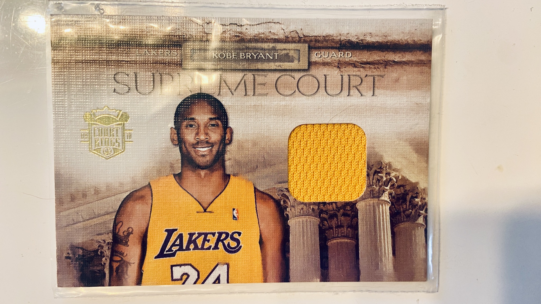 What is the value of a Kobe game-worn jersey card, Panini 43/99?
