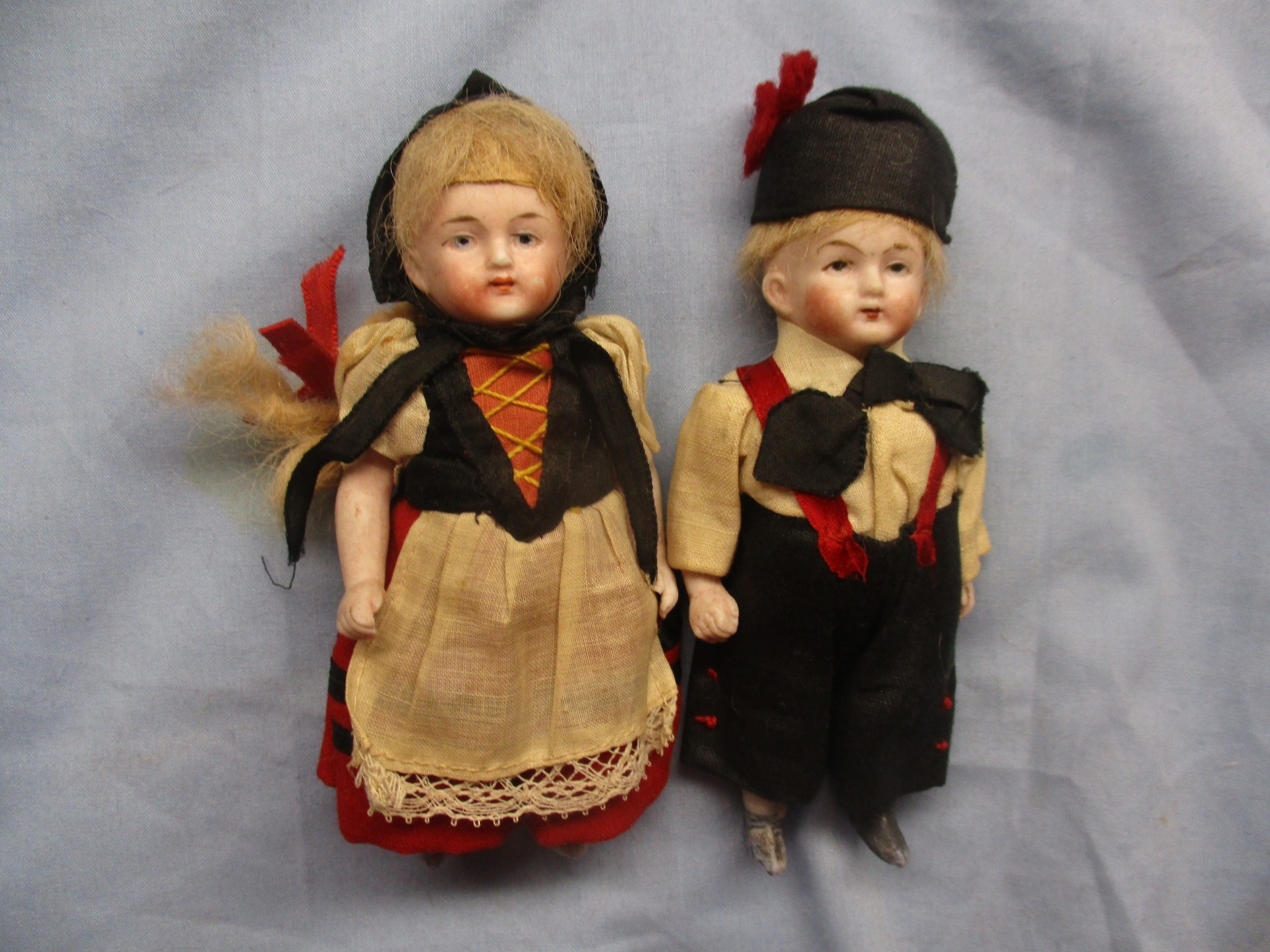 Antique German bisque bust pair, boy & girl - Hertwig & Co