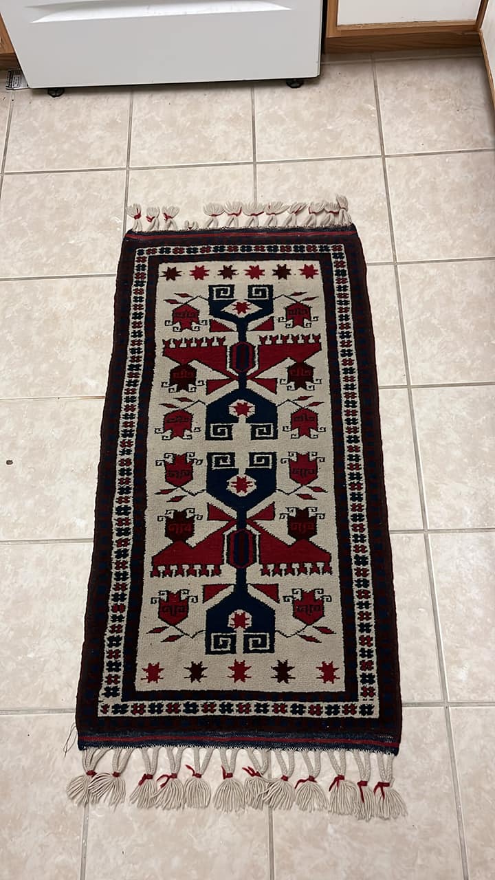 A vintage rug/tapestry by the artist “Tere” Teresa Gonzalez, found