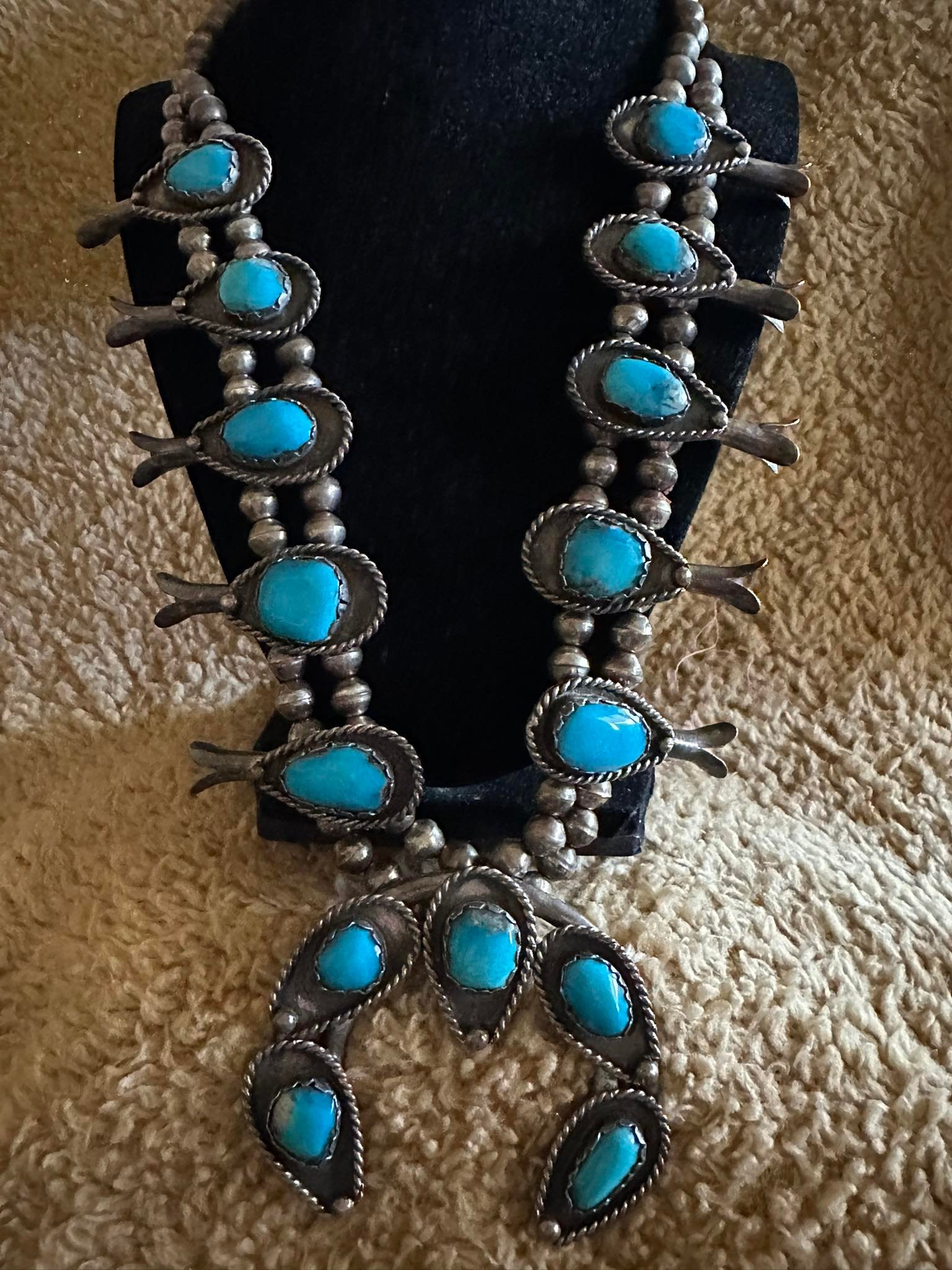 What is the age and possible maker of this Navajo squash blossom 