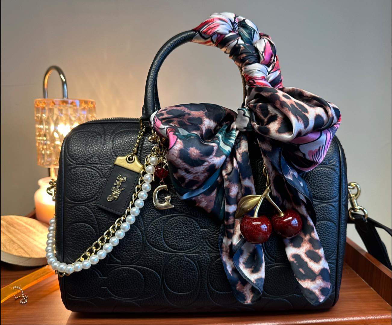Dressing up coach bags with accessories