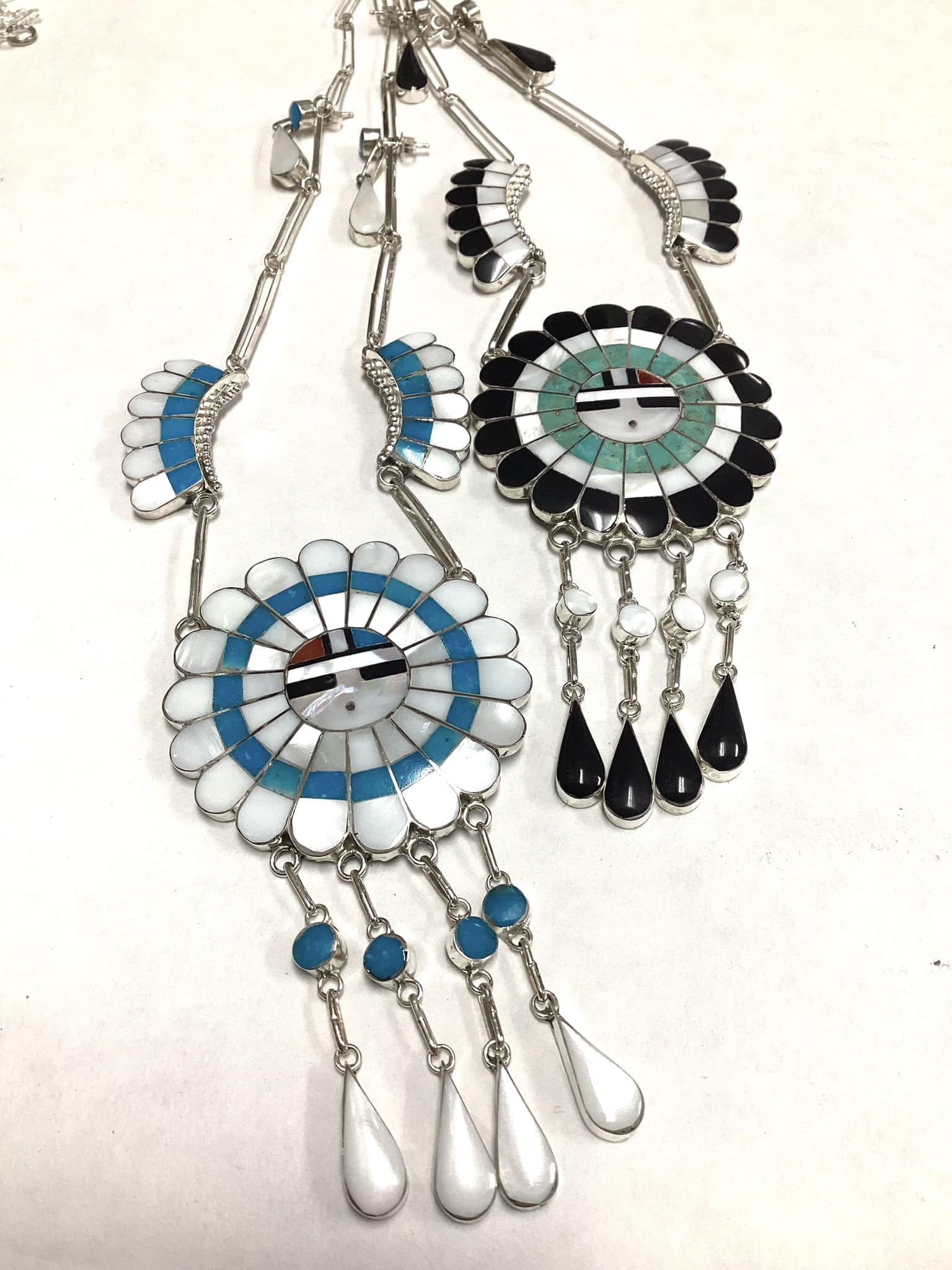 Zuni Sunface inlay necklaces created by Bryant Othole and J.D. Massie.