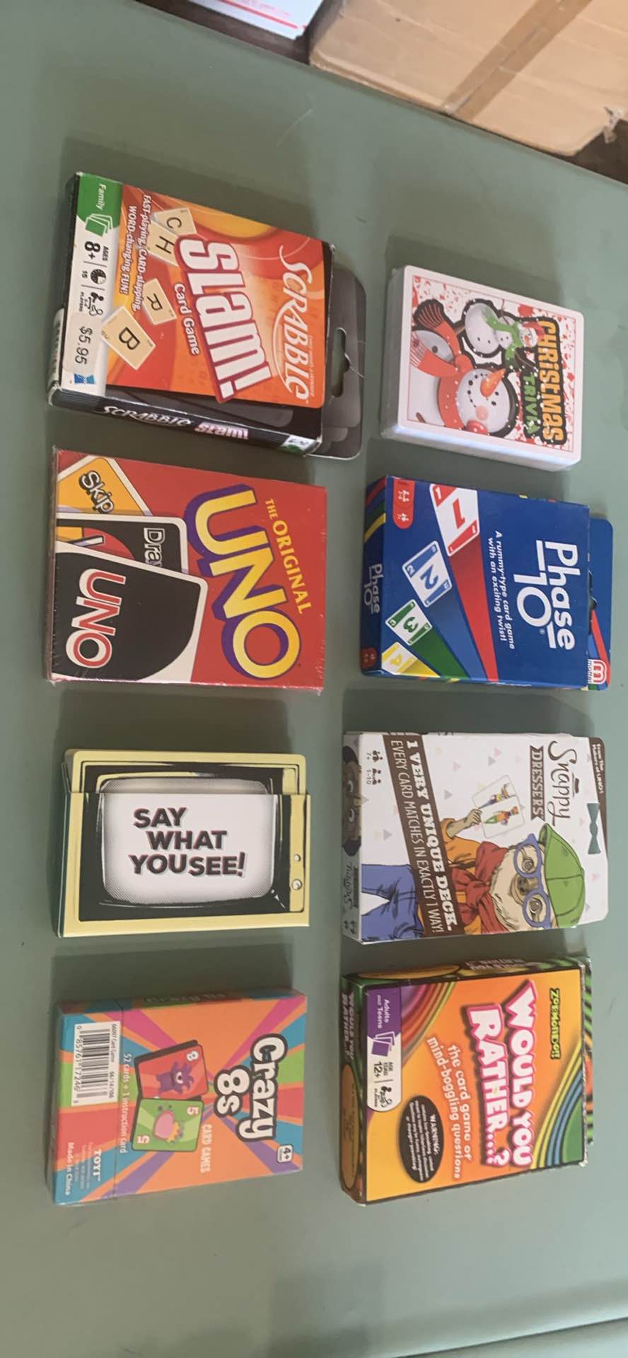 SCRABBLE SLAM! Card Game, UNO The Original, Phase 10, Snappy DRESSERS, WOULD YOU RATHER…?, SAY WHAT YOU SEE!, CRAZY 8s, CHRISTMAS TRIVIA