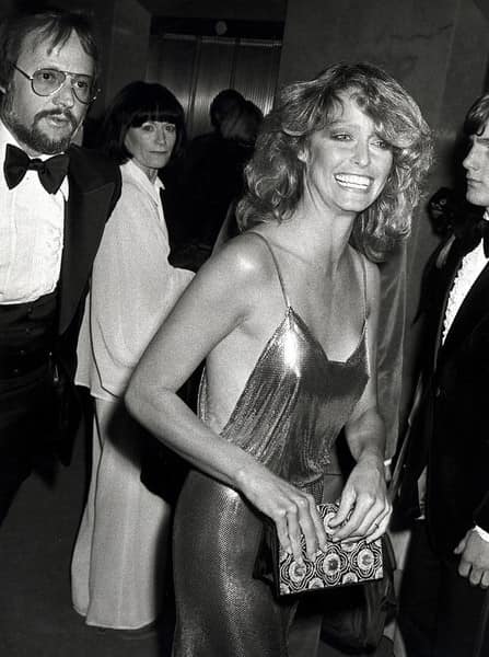 farrah fawcett gold dress decided to go in a slinky to the 1978 Oscars, where she presented the award for Best Film Editing. The gold chainmail tank dress dipped low at the Occasion-Wedding