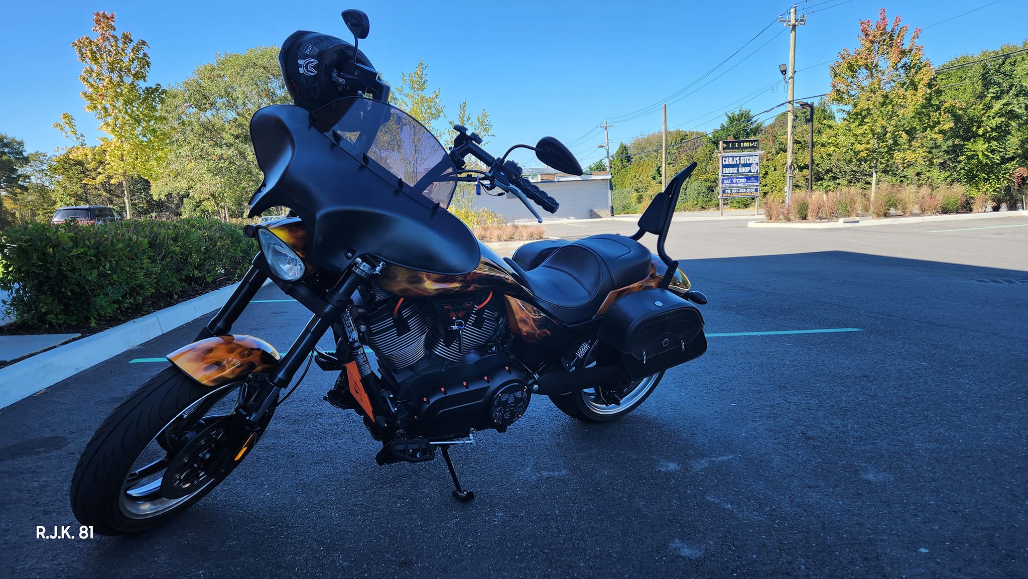 Victory motorcycle customization with orange oil cooler cover and