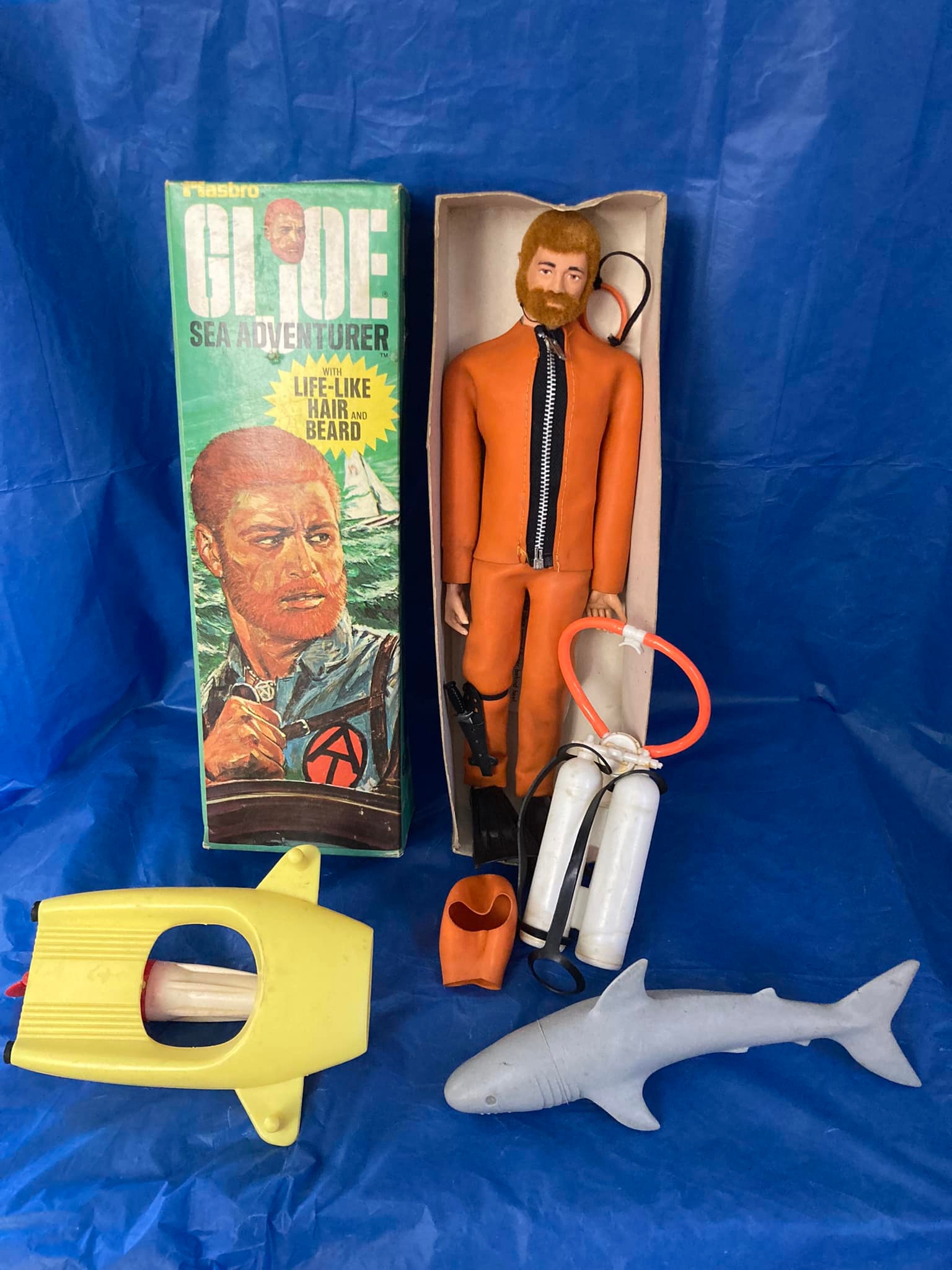 Vintage GI Joe figure in original orange flight suit
