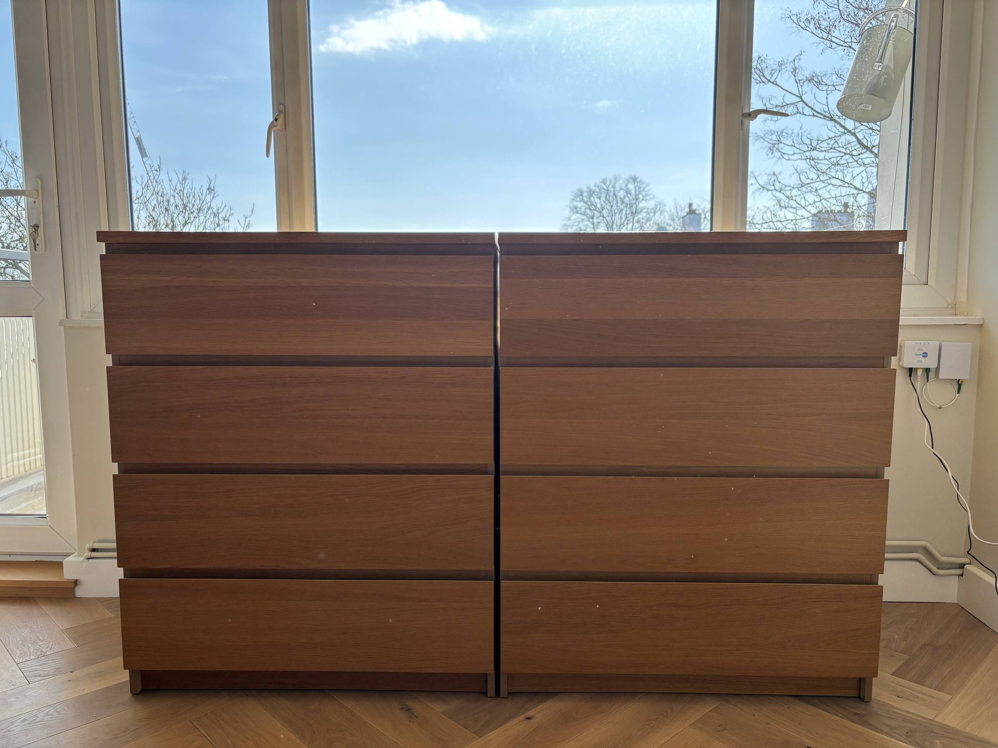 Selling two IKEA MALM 6-drawer chests in the brown stained ash veneer finish. These are fantastic, sturdy dressers that offer a sleek, modern look that fits seamlessly with any bedroom decor. They