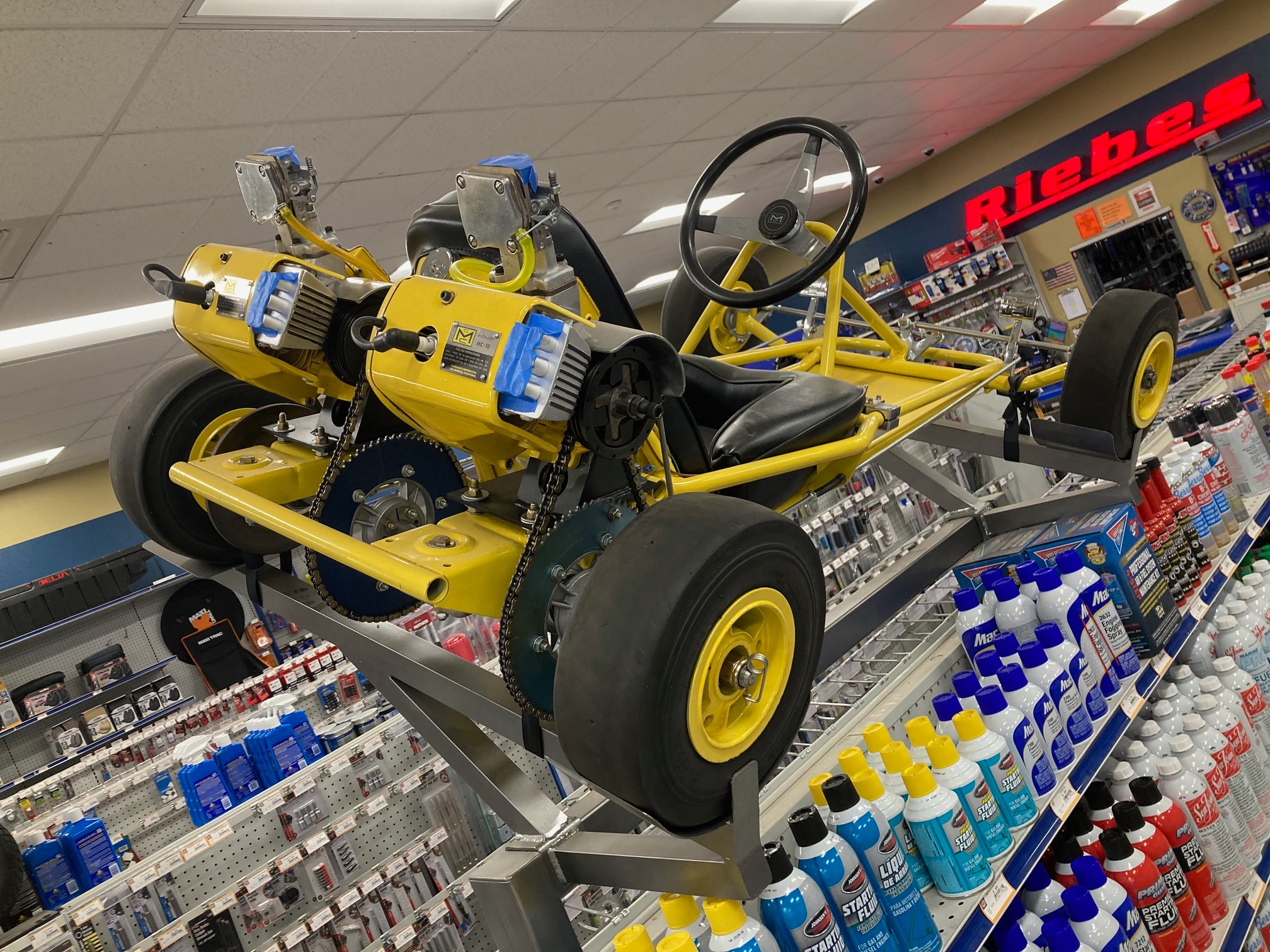 Vintage racing cart with twin McCulloch MC-10's at local car parts