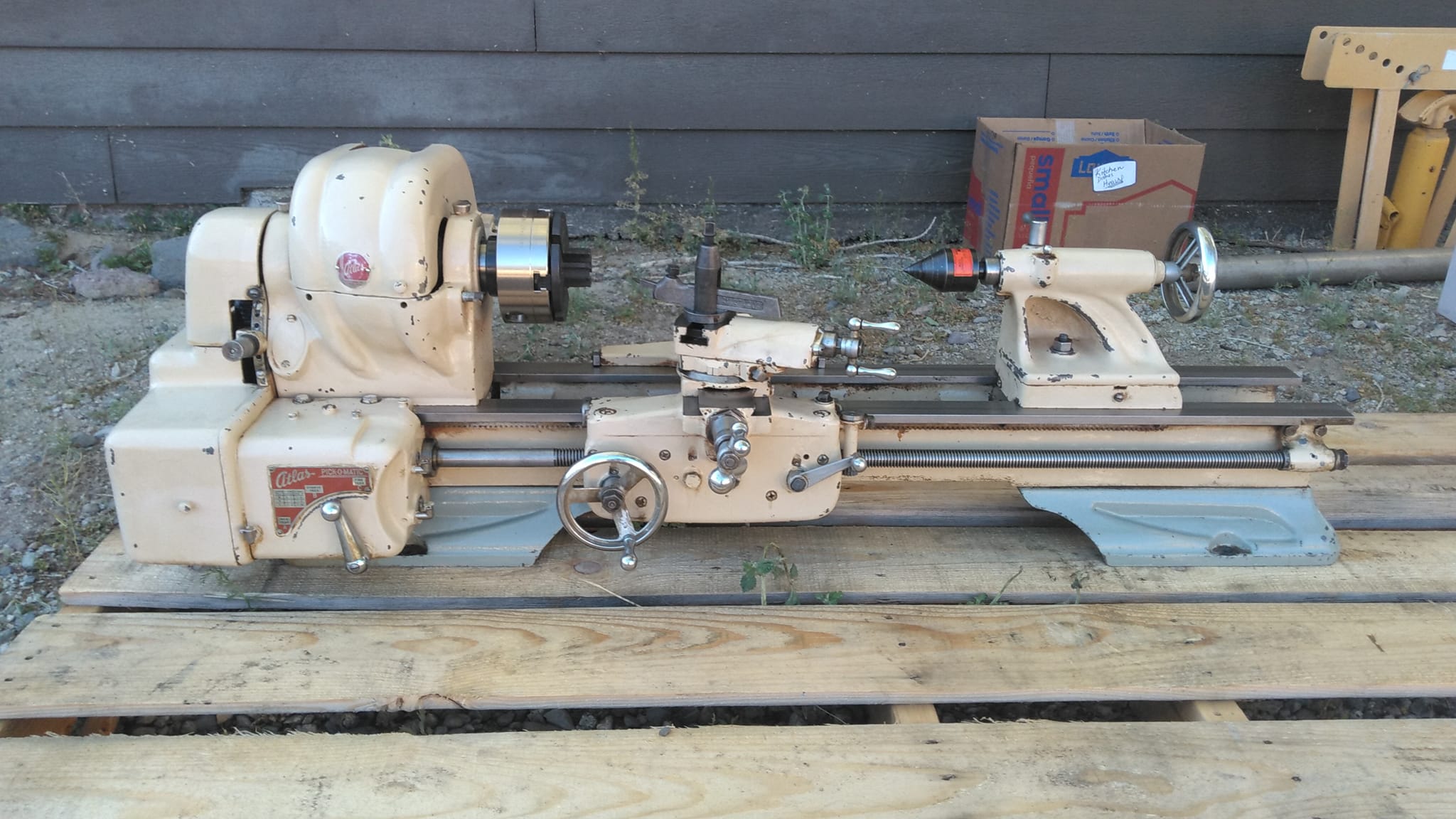 What is the vintage and model number of the Atlas lathe?