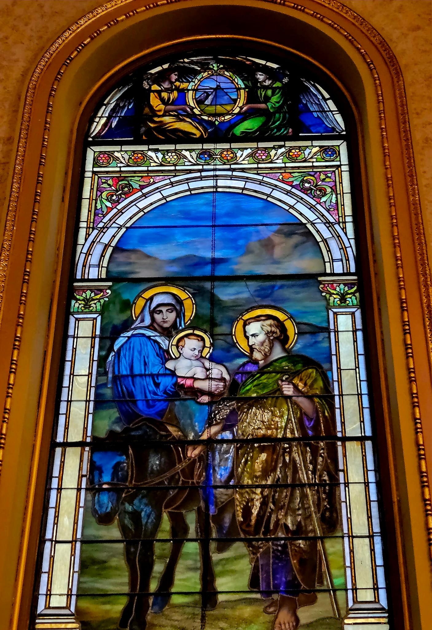 Stained glass window of the Flight into Egypt at Co-Cathedral of
