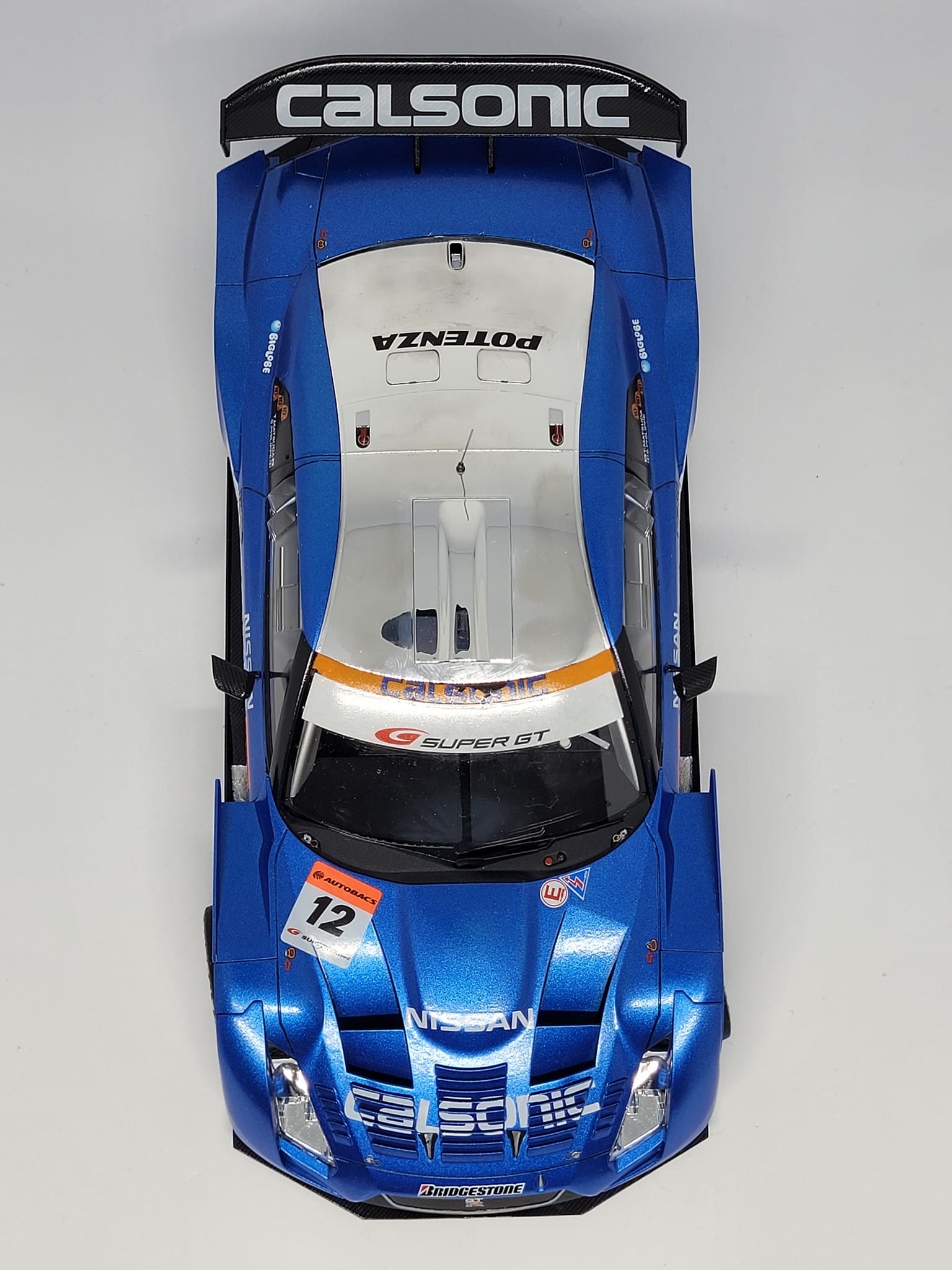 Tamiya 1/24 Nissan Skyline GTR R35 model in metallic blue