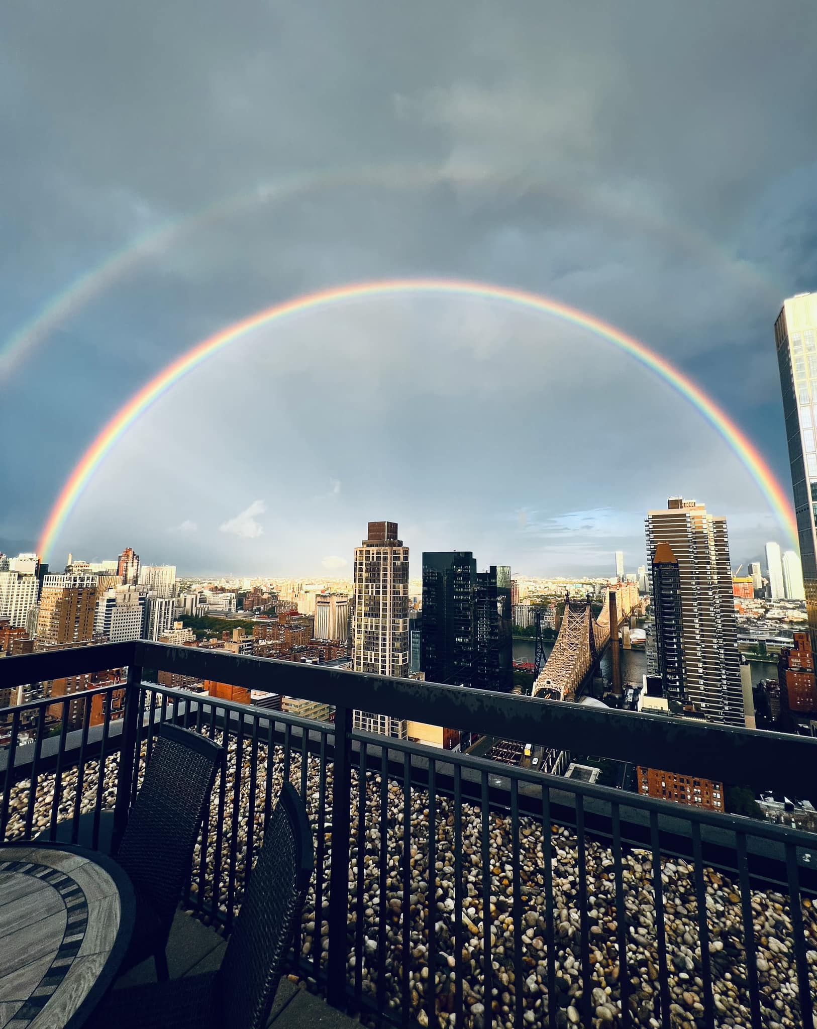 A rainbow was captured extending from the top of the Empire State 