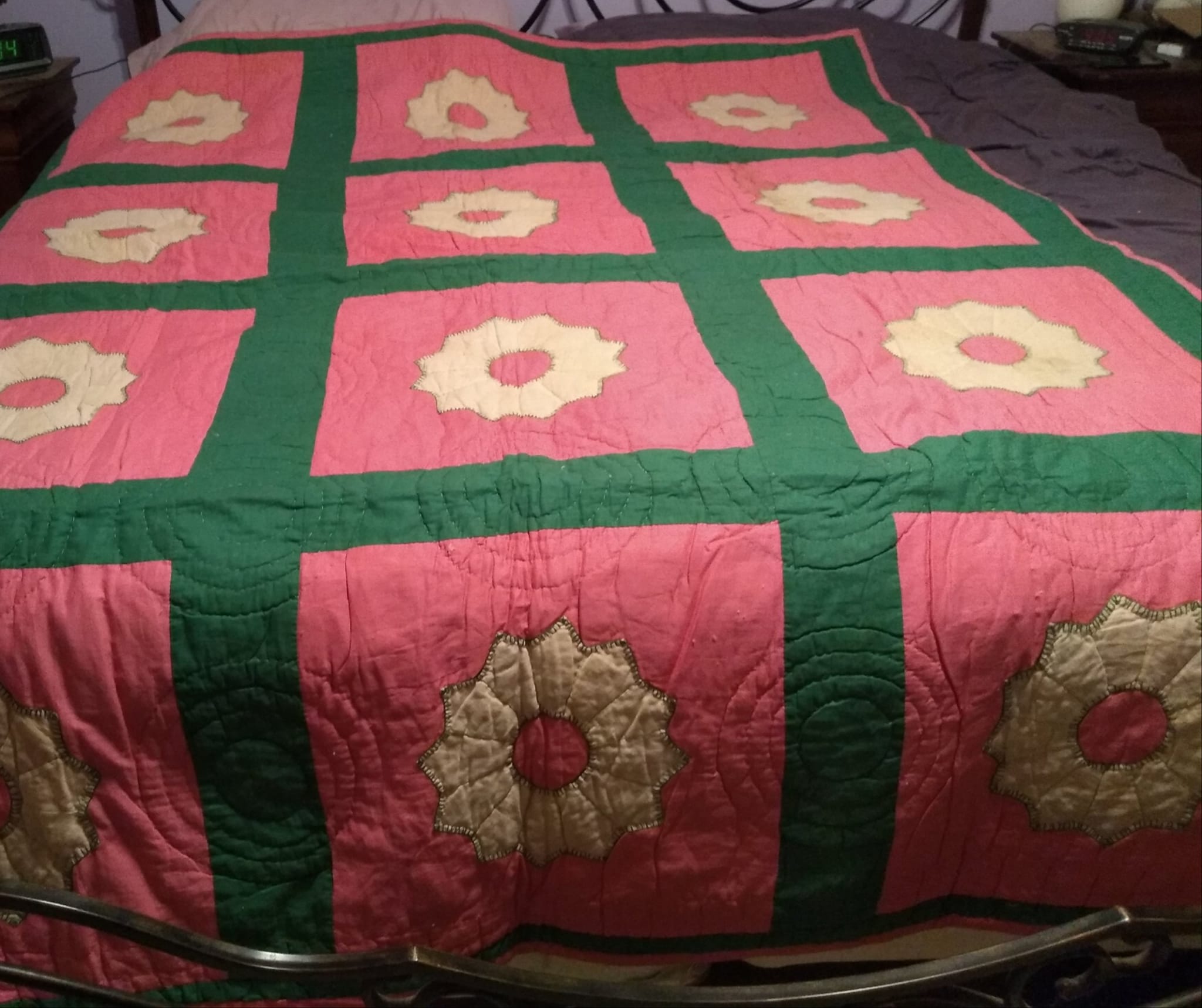 Antique quilt with bull durham tobacco bag flowers