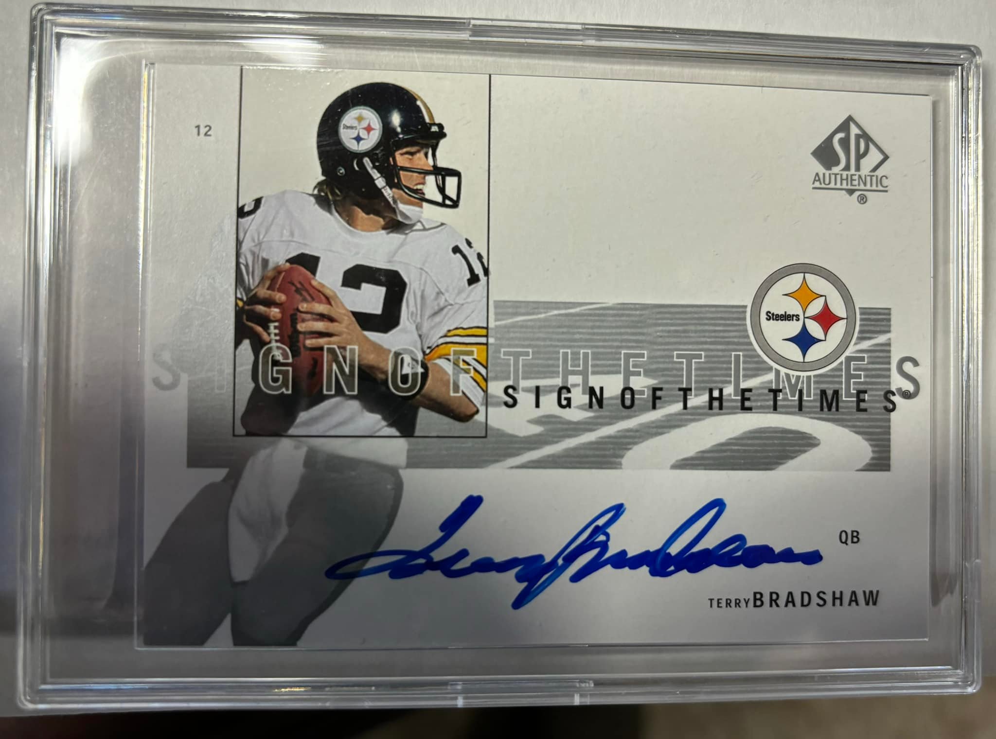 What's the value of a dual-signed Terry Bradshaw spa card?