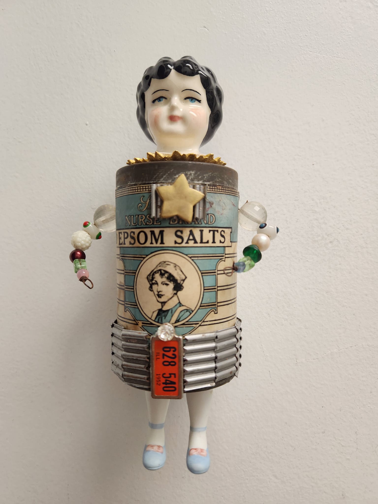 Vintage tins with vintage doll heads, mixed esemblage