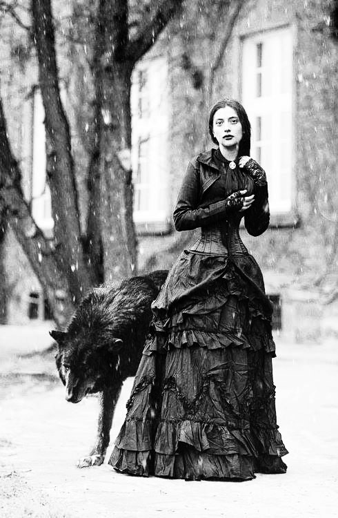 Mystical portrait of a woman with a wolf
