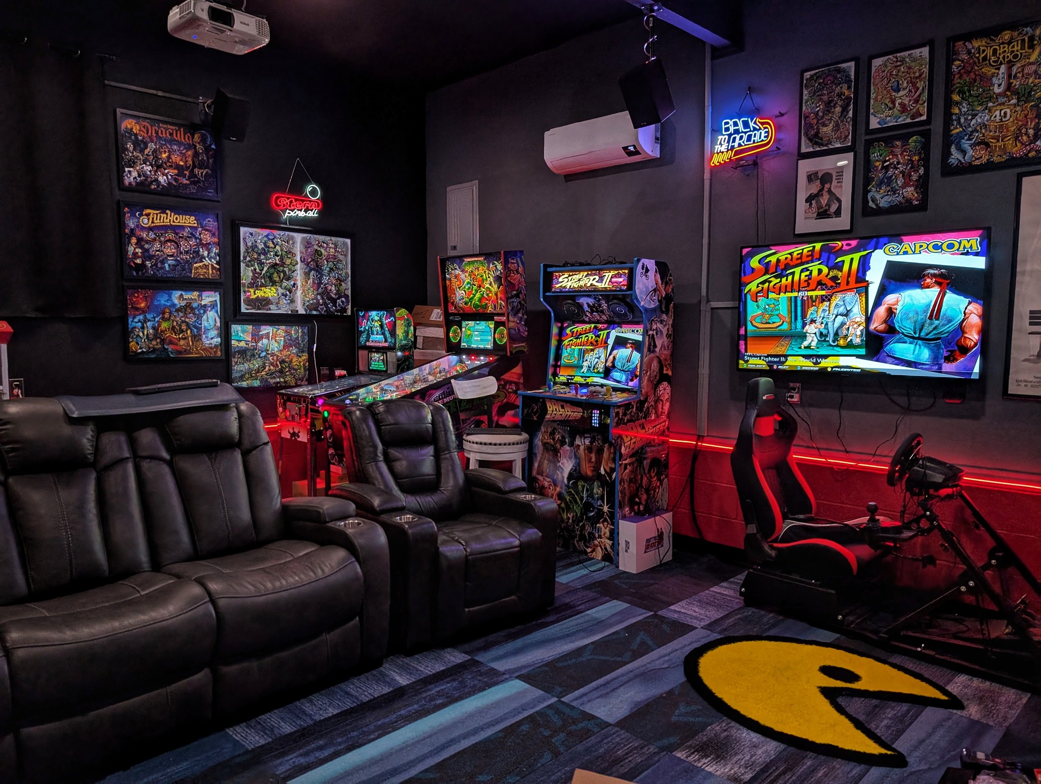 Man cave with pinball and projector