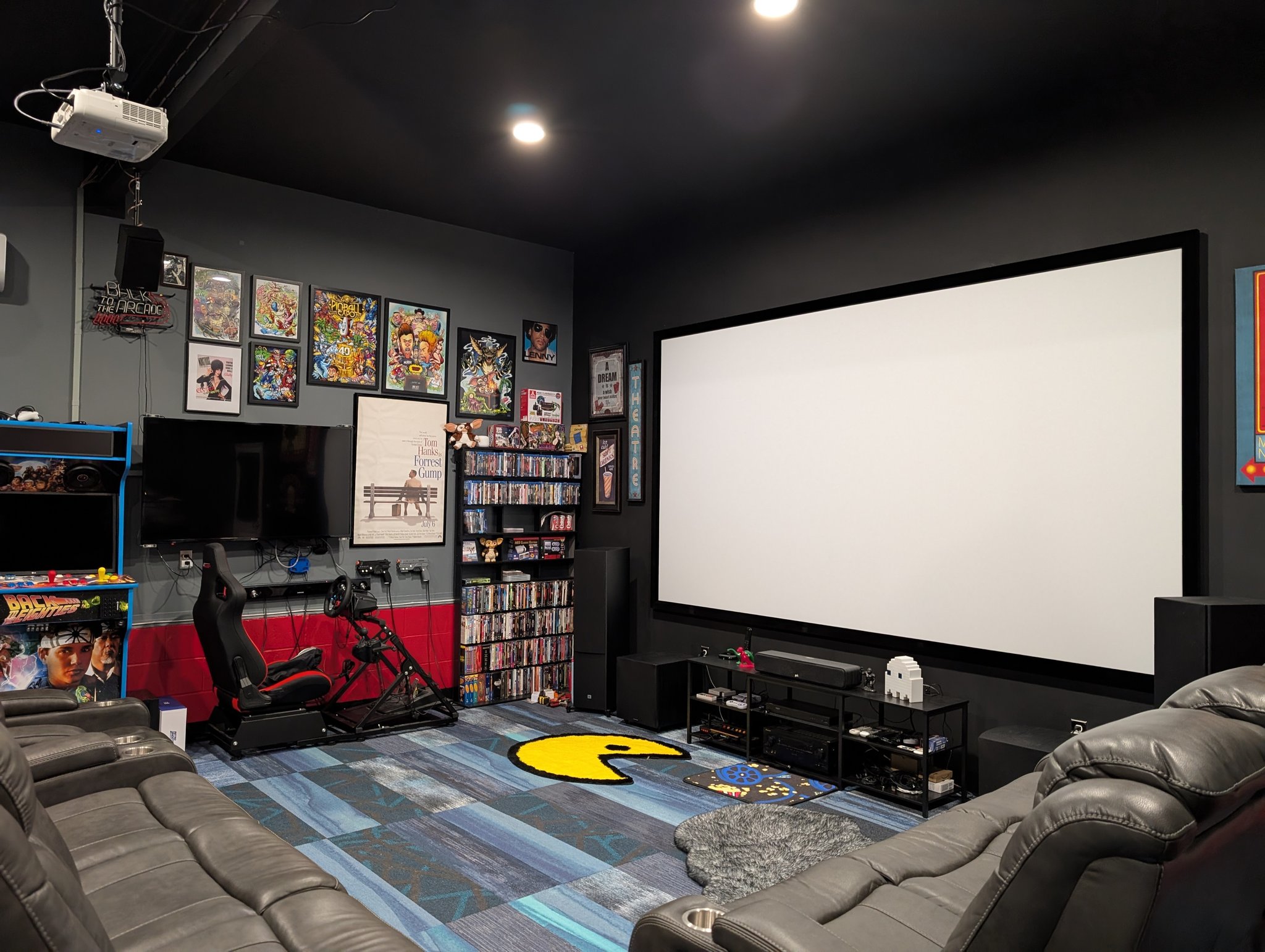 Man cave with pinball and projector