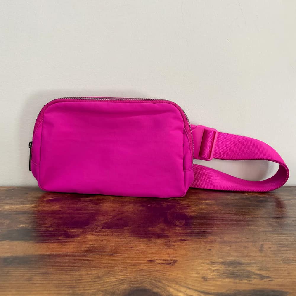 hot pink lululemon fanny pack Solid Belt Bag with Striped Strap Our Fanny Sling is the cross body bag youve been waiting for Sonic Pink Lululemon Belt Bag:
